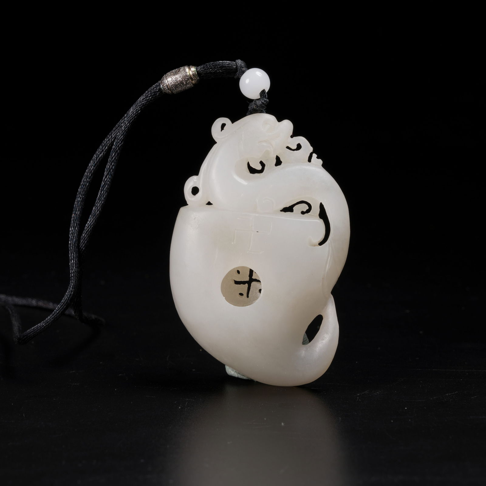 A HETIAN JADE DRAGON-PATTERN PENDANT (1 of 8)