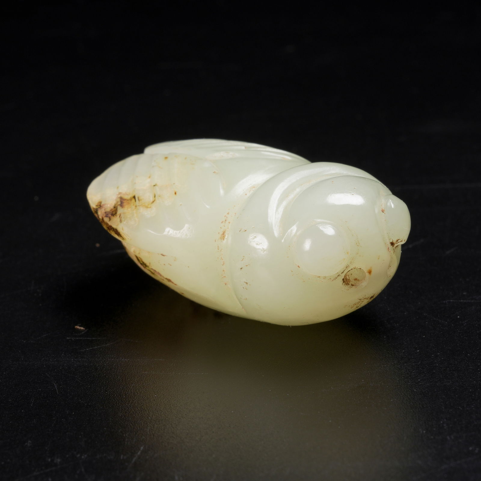 A HETIAN JADE CICADA PENDANT: Hetian Jade Cicada Pendant