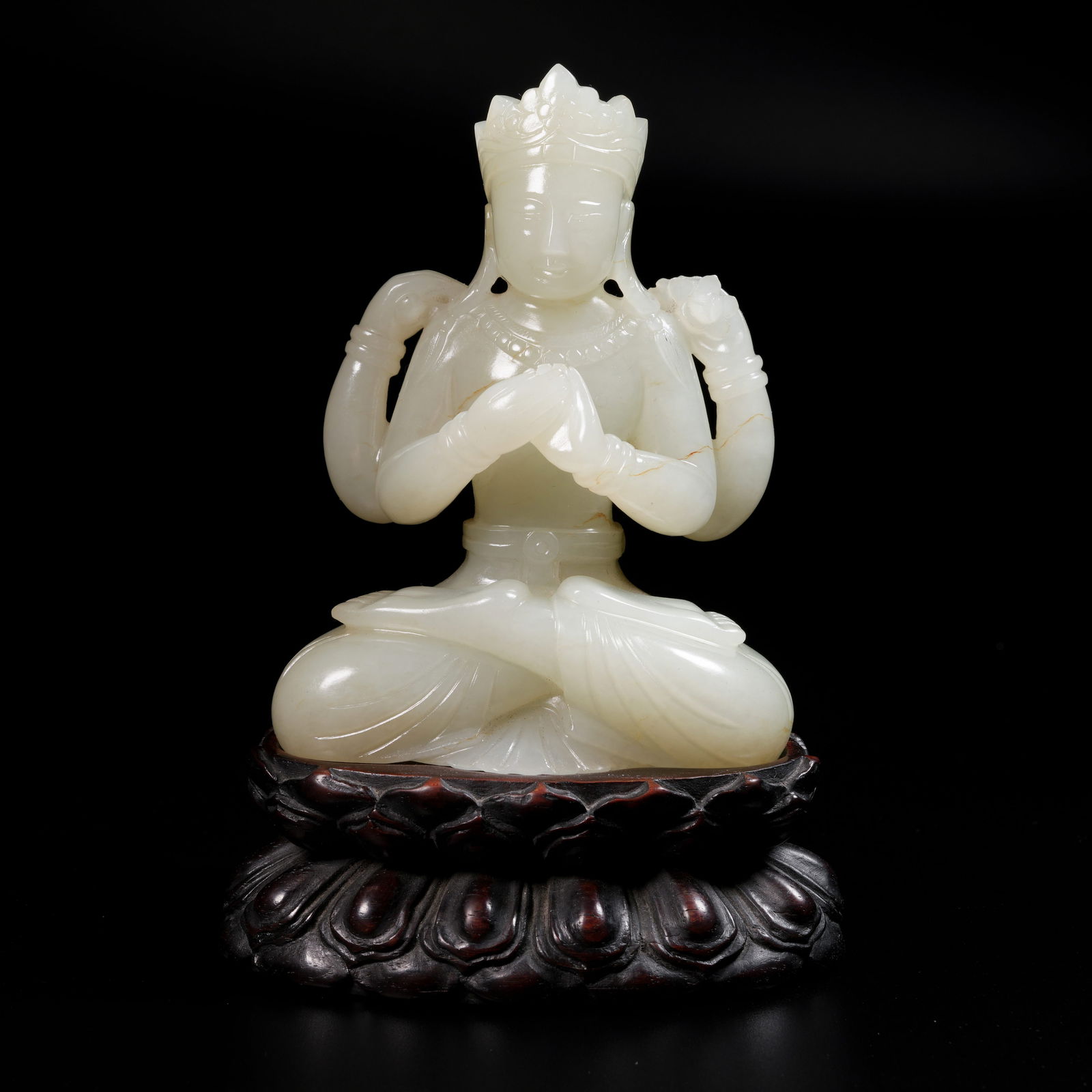 A HETIAN WHITE JADE FOUR-ARMED GUANYIN FIGURE (1 of 9)