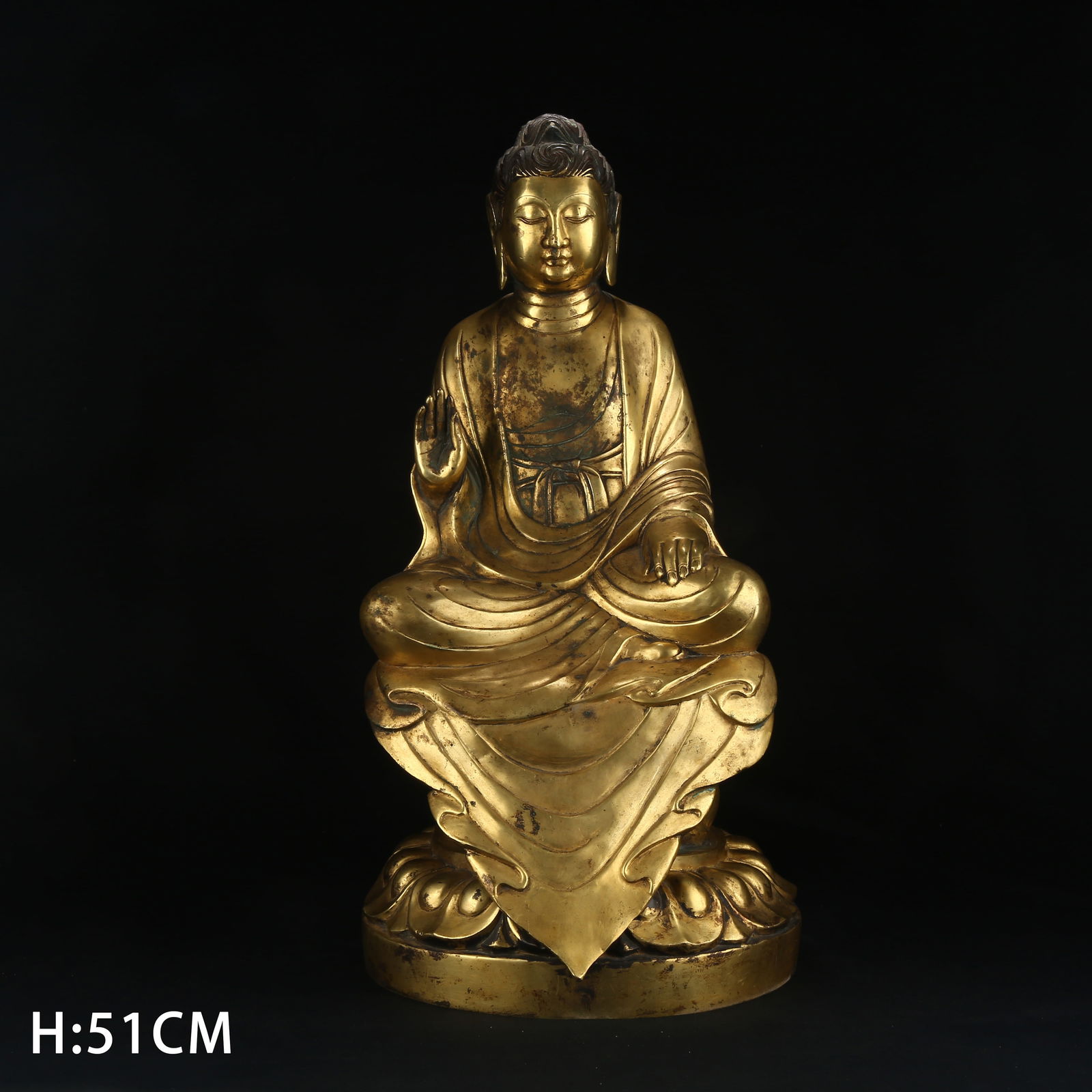 A GILT BRONZE FIGURE OF AMOGHASIDDHI BUDDHA: Gilt Bronze Figure of Amoghasiddhi Buddha