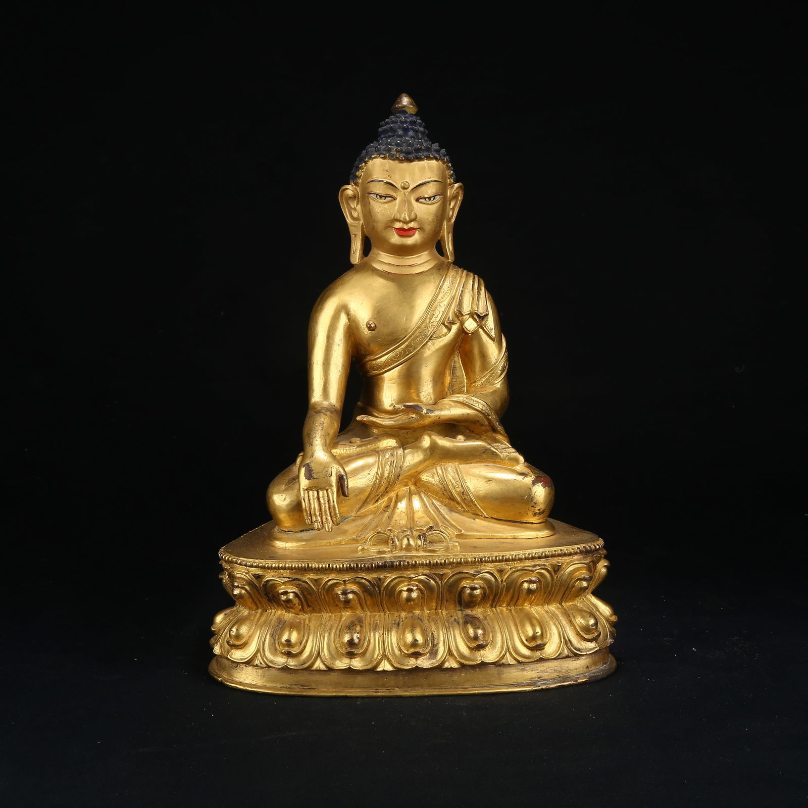 A GILT BRONZE FIGURE OF SHAKYAMUNI BUDDHA: Gilt Bronze Figure of Shakyamuni Buddha