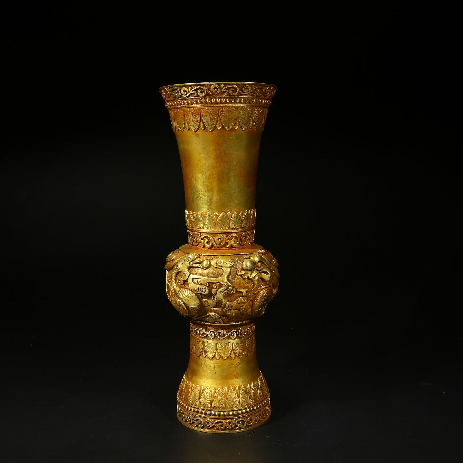 A BRONZE GILT FLOWER GU (RITUAL BEAKER) WITH DRAGON AND PHOENIX PATTERNS (1 of 9)