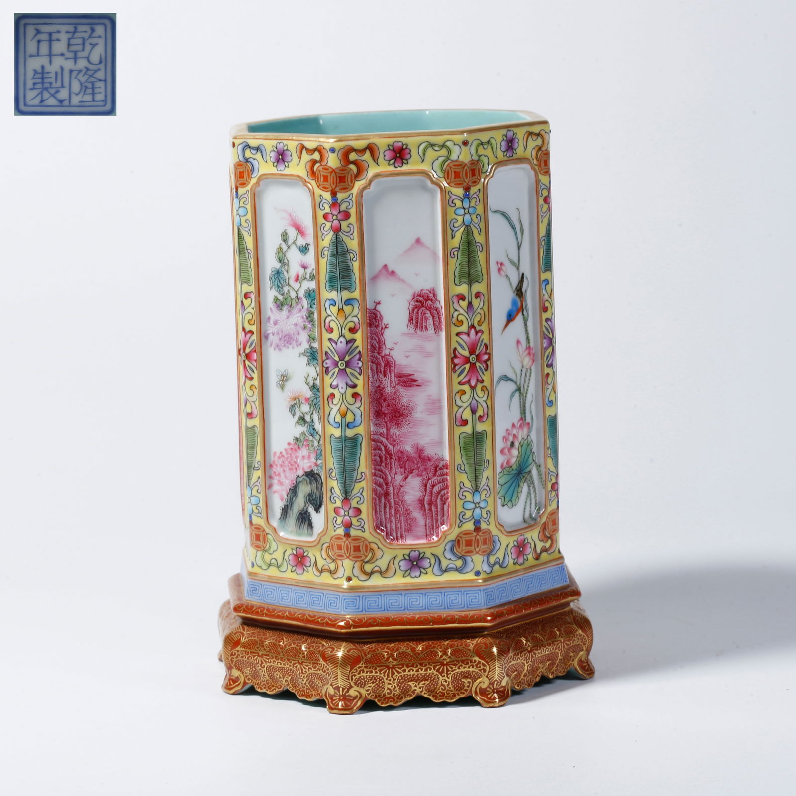 A FAMILLE ROSE BRUSH POT WITH FLORAL AND BIRD DESIGN IN OPEN PANELS: Famille rose brush pot with floral and bird design in open panels