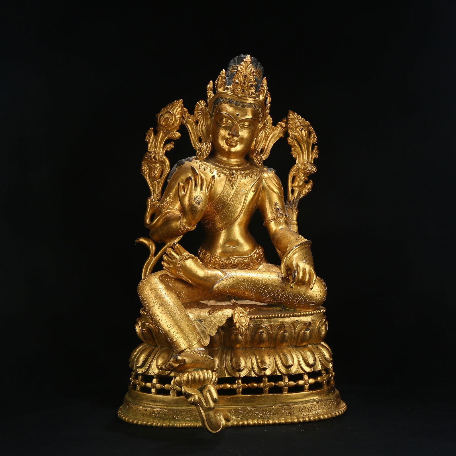 A GILT BRONZE FIGURE OF AVALOKITESHVARA IN ROYAL EASE POSE (1 of 8)