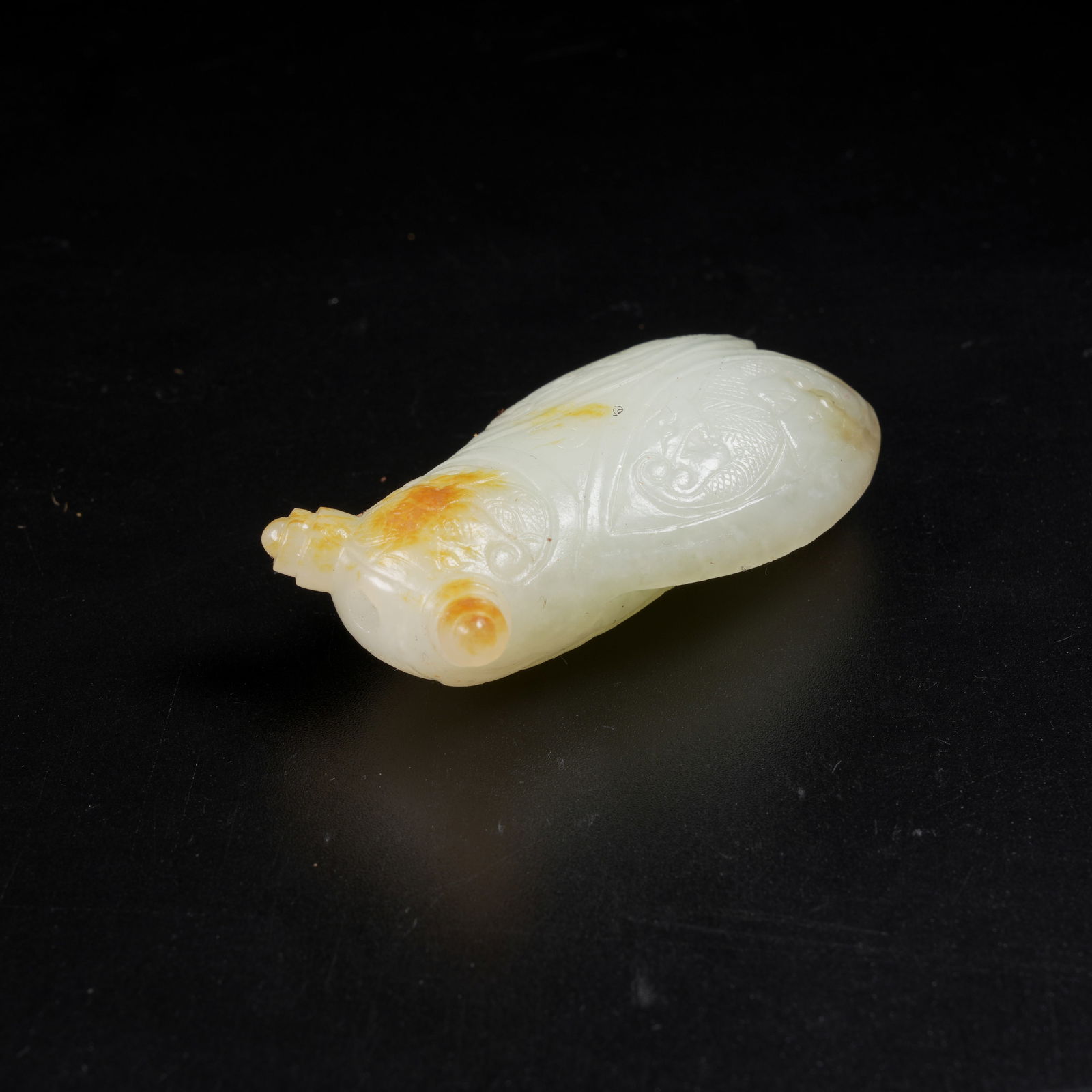 A HETIAN JADE CICADA PENDANT: Hetian Jade Cicada Pendant