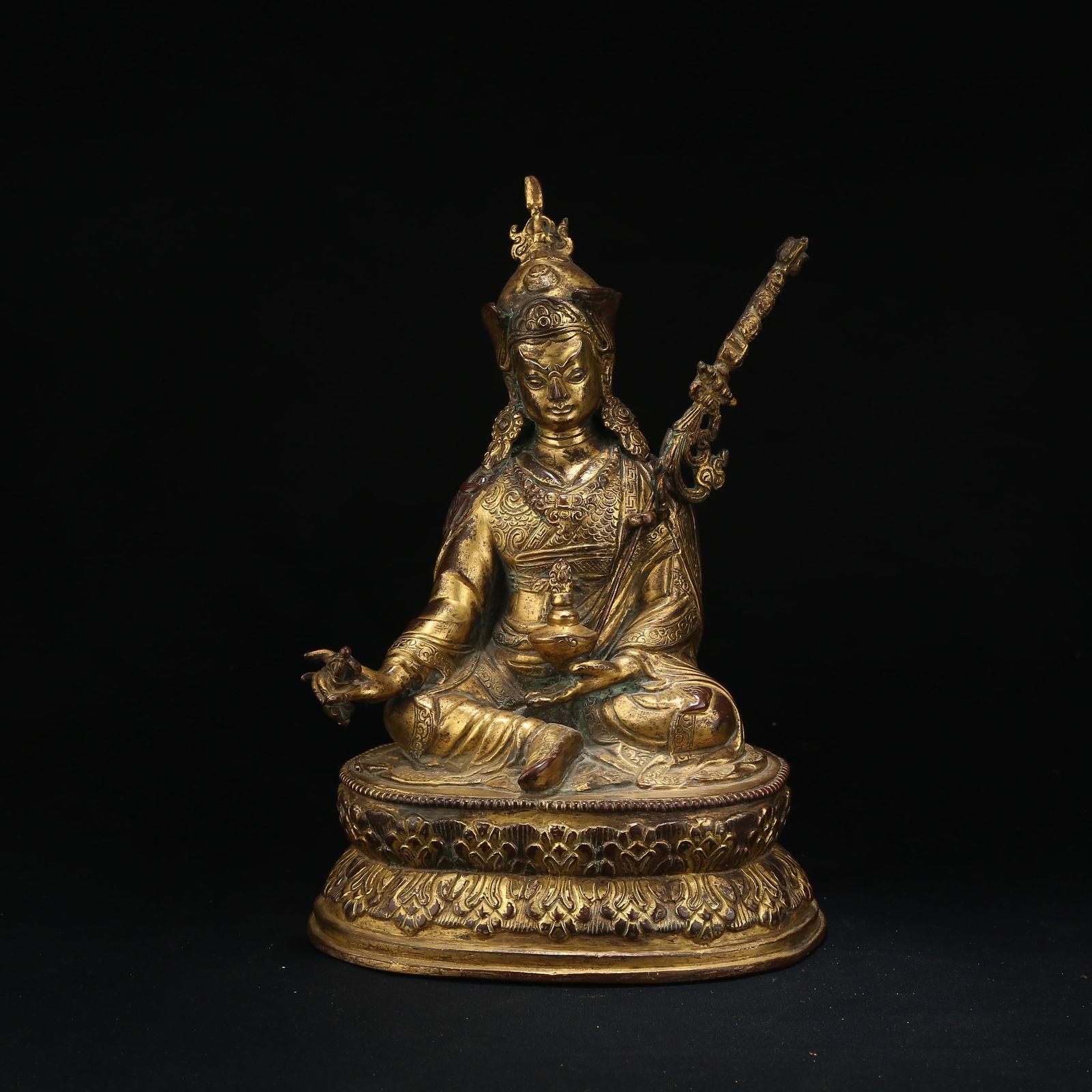 A GILT BRONZE FIGURE OF PADMASAMBHAVA (1 of 8)