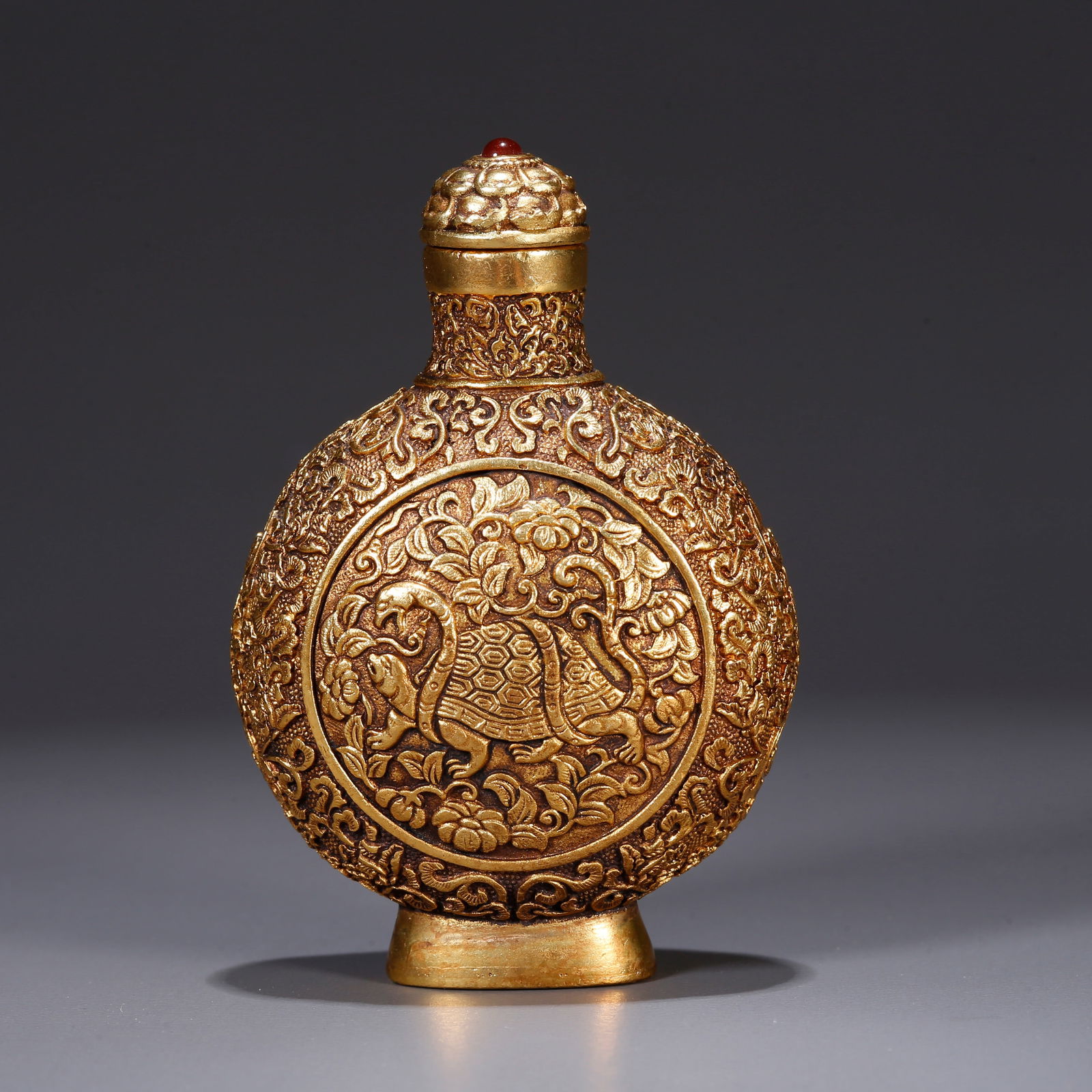 A GILT BRONZE SNUFF BOTTLE WITH XUANWU MOTIF (1 of 10)