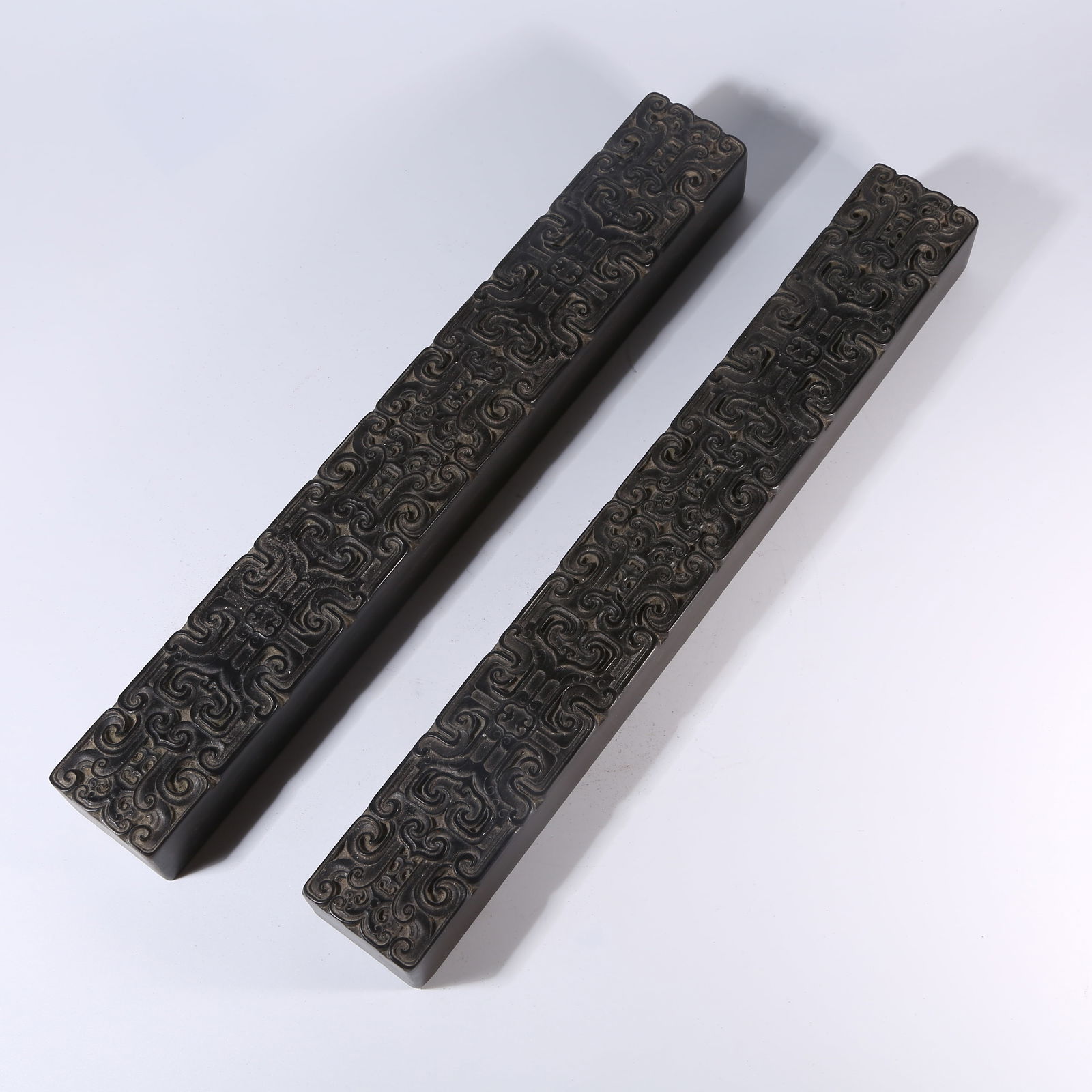 A ZITAN PAPERWEIGHT SET WITH TAOTIE PATTERN: Zitan Paperweight Set with Taotie Pattern