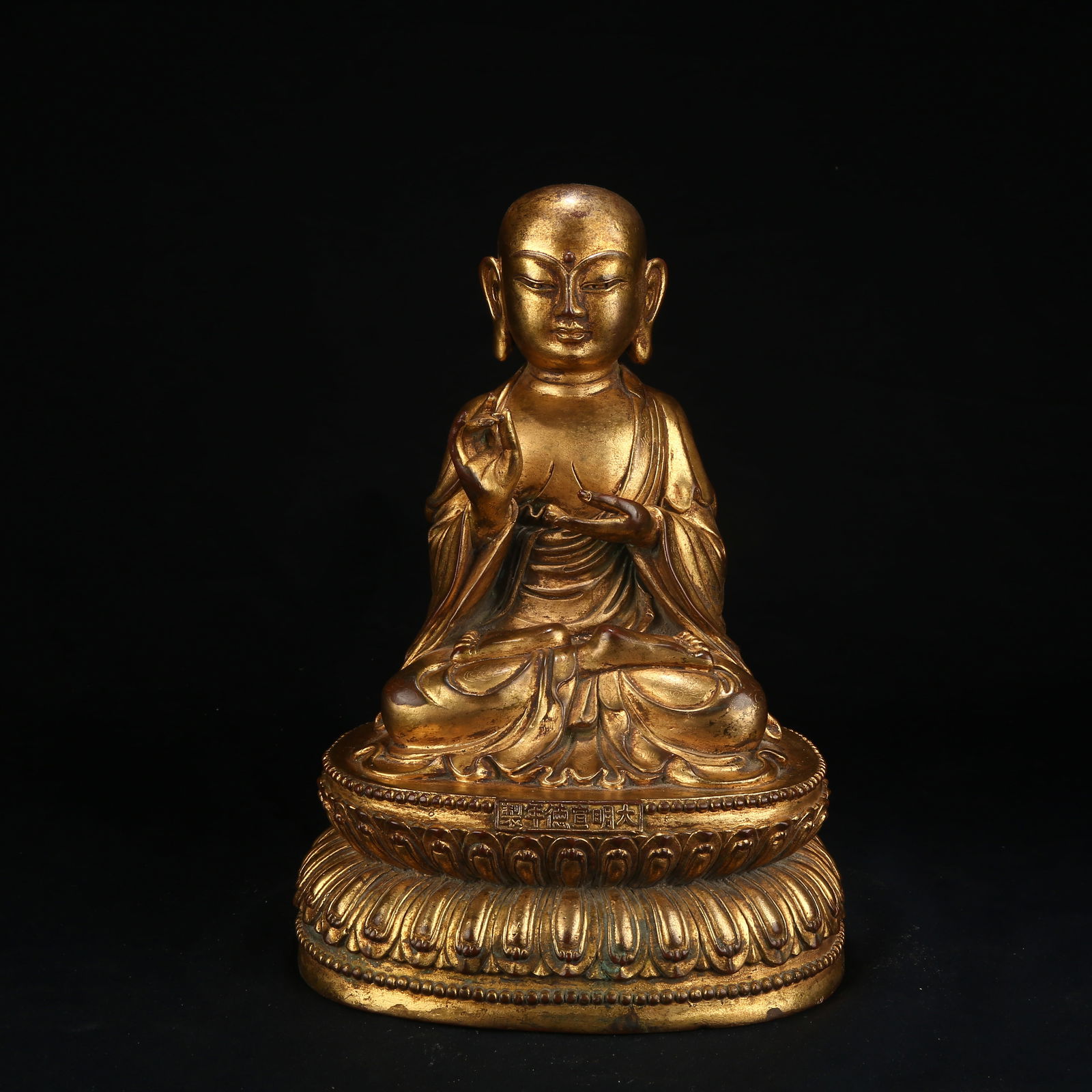 A GILT BRONZE FIGURE OF AN ARHAT (1 of 8)