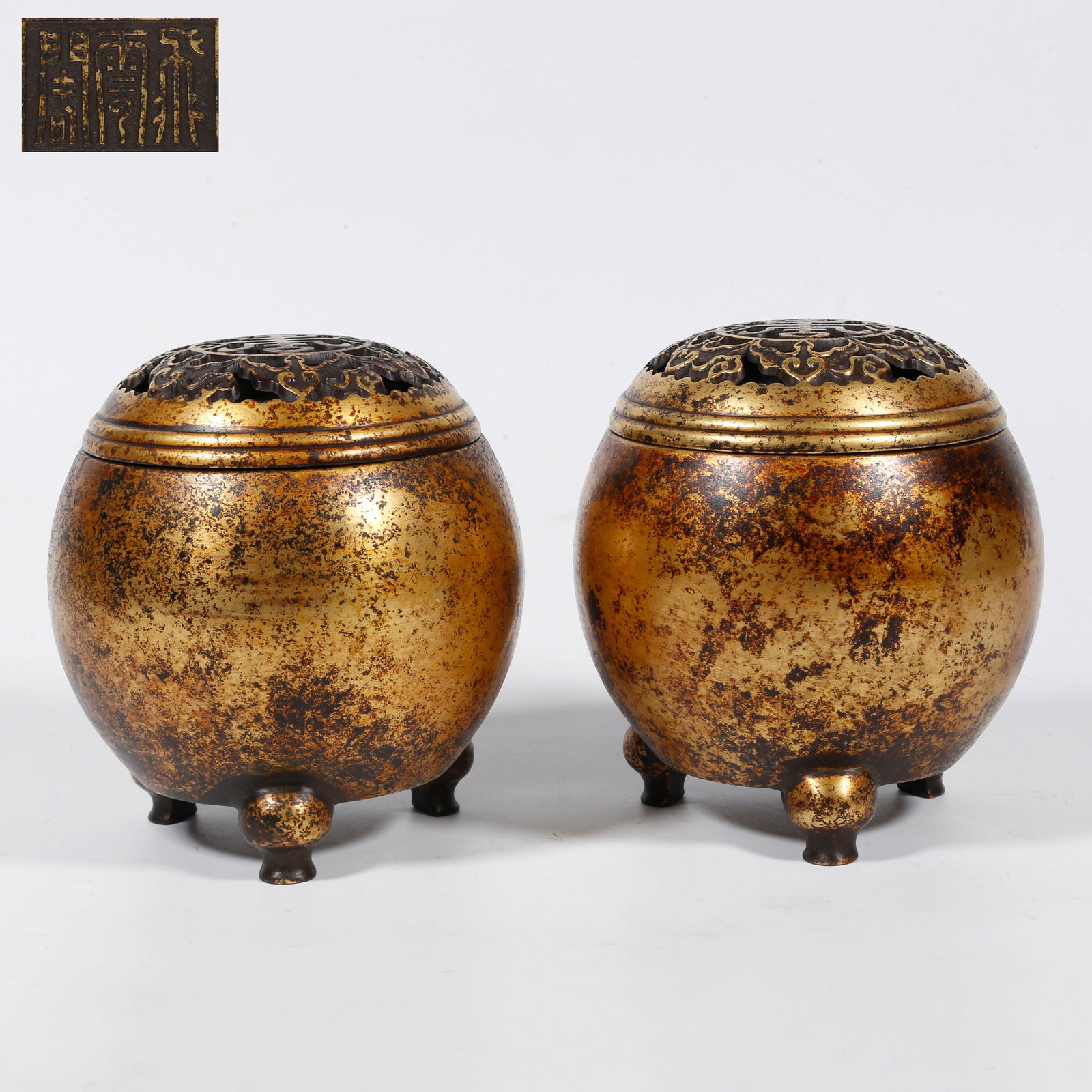 A GILT-BRONZE INCENSE BURNERS WITH FIVE BLESSINGS HOLDING LONGEVITY MOTIF (PAIR): Gilt-bronze incense burners with Five Blessings holding Longevity motif (pair)