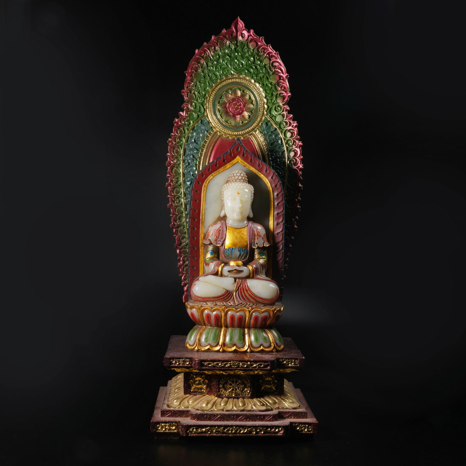 A GILT-BRONZE AND ENAMEL STATUE OF MEDICINE BUDDHA INLAID WITH HETIAN WHITE JADE: Gilt-bronze and enamel statue of Medicine Buddha inlaid with Hetian white jade