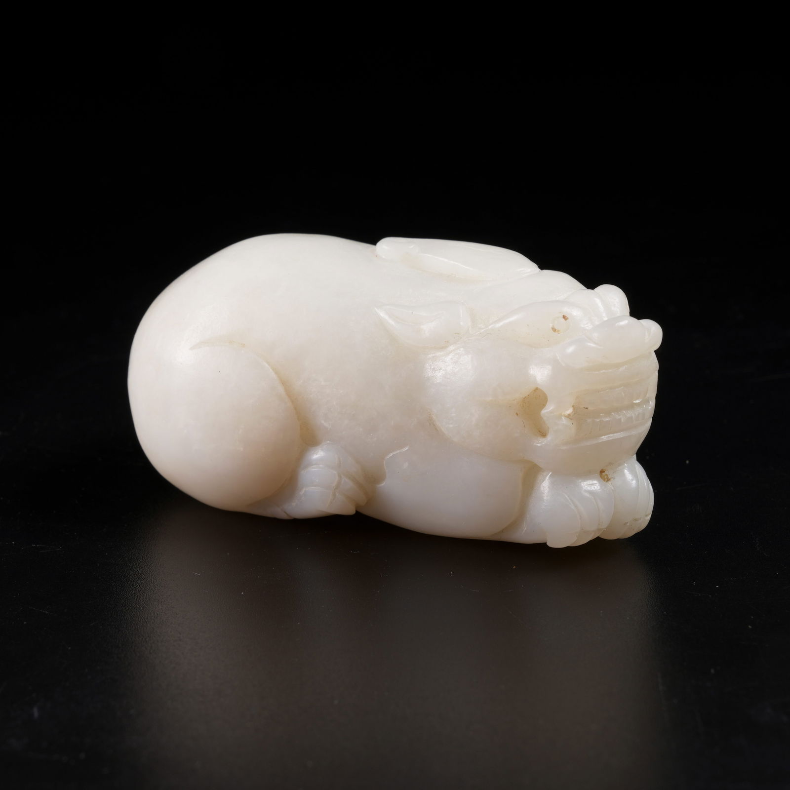 A HETIAN JADE AUSPICIOUS BEAST CARVING (1 of 8)