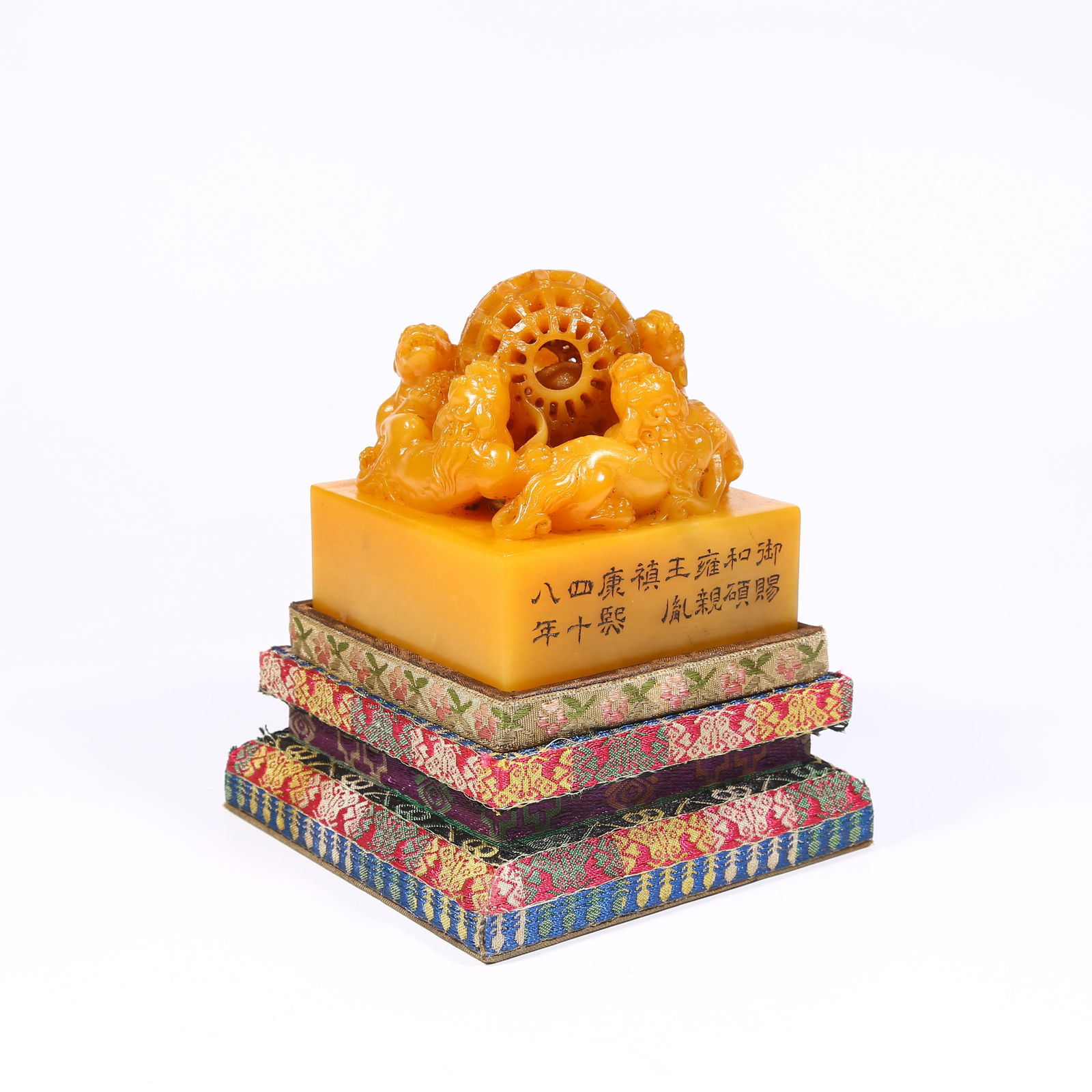 A SHOUSHAN TIANHUANG STONE SEAL WITH LION PLAYING WITH BROCADE BALL: Shoushan Tianhuang stone seal with lion playing with brocade ball