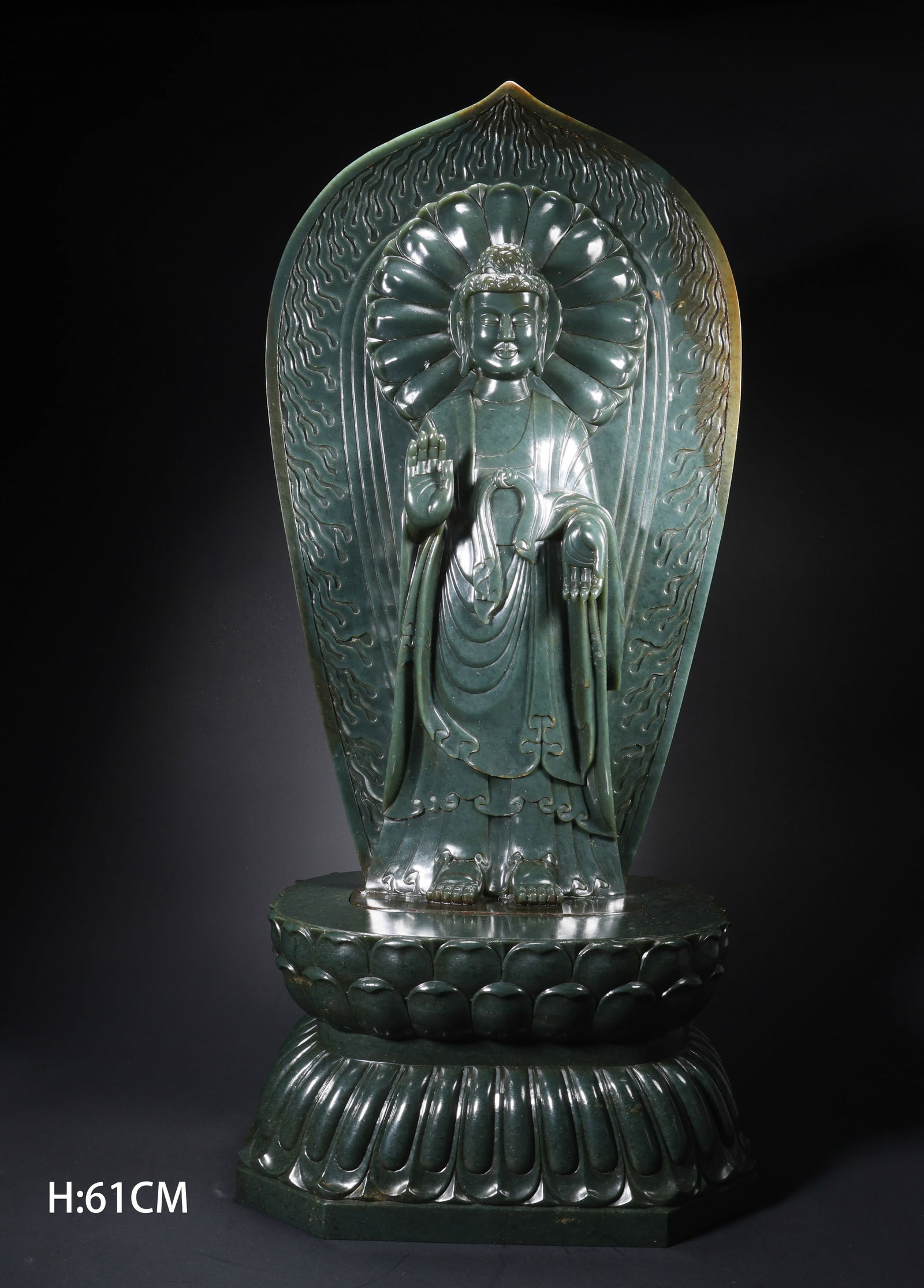 A HETIAN JADE STANDING GUANYIN WITH HALO ON LOTUS BASE: Hetian Jade Standing Guanyin with Halo on Lotus Base