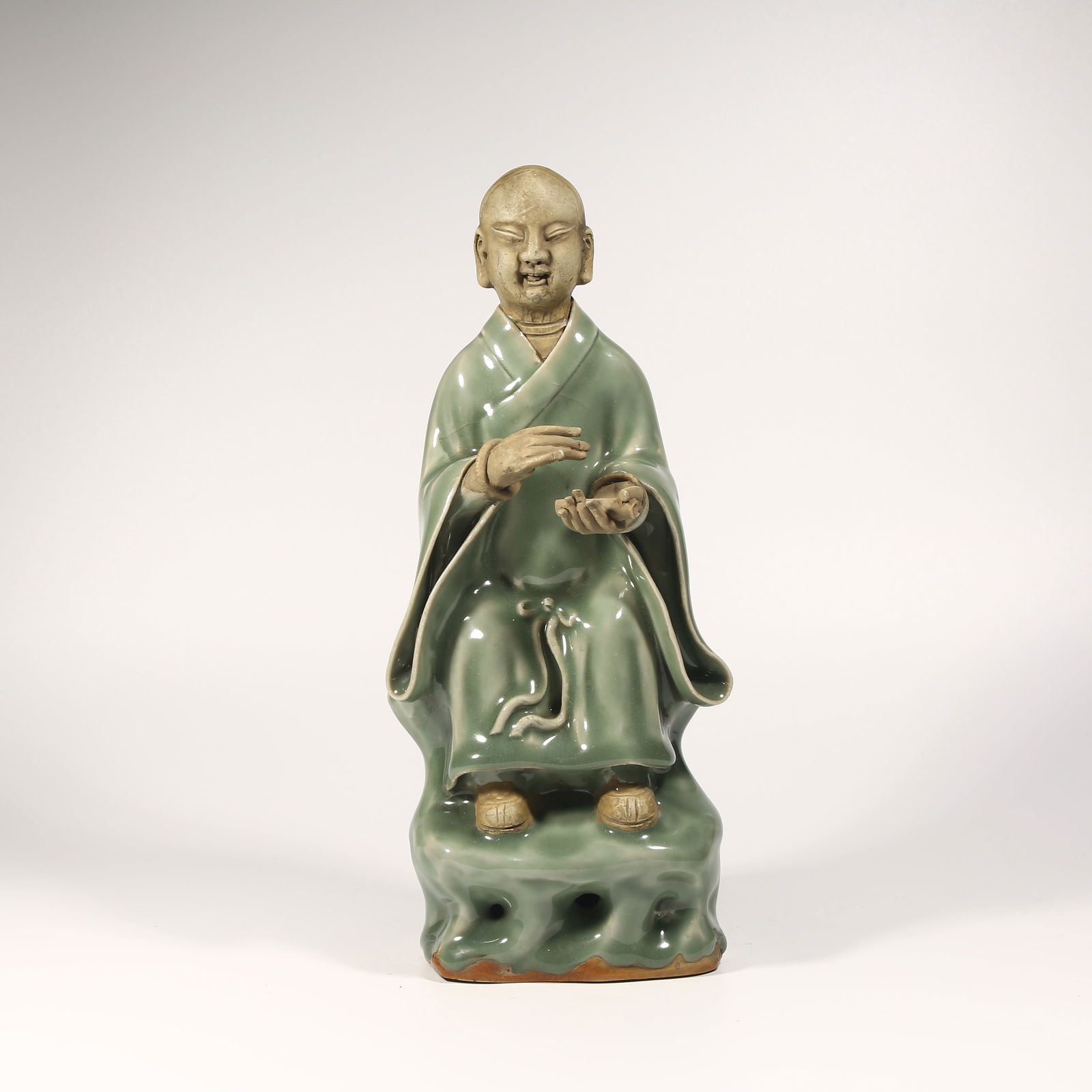 A LONGQUAN KILN OPEN-PORCELAIN ARHAT FIGURE (1 of 8)