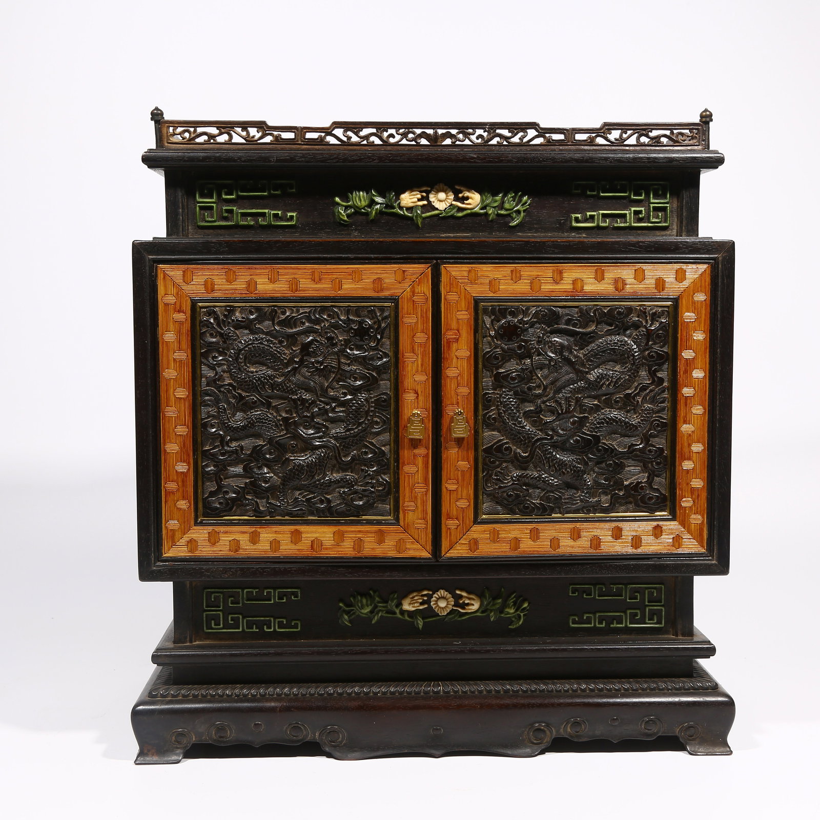 A ZITAN WOOD CABINET WITH CLOUD AND DRAGON MOTIF: Zitan Wood Cabinet with Cloud and Dragon Motif