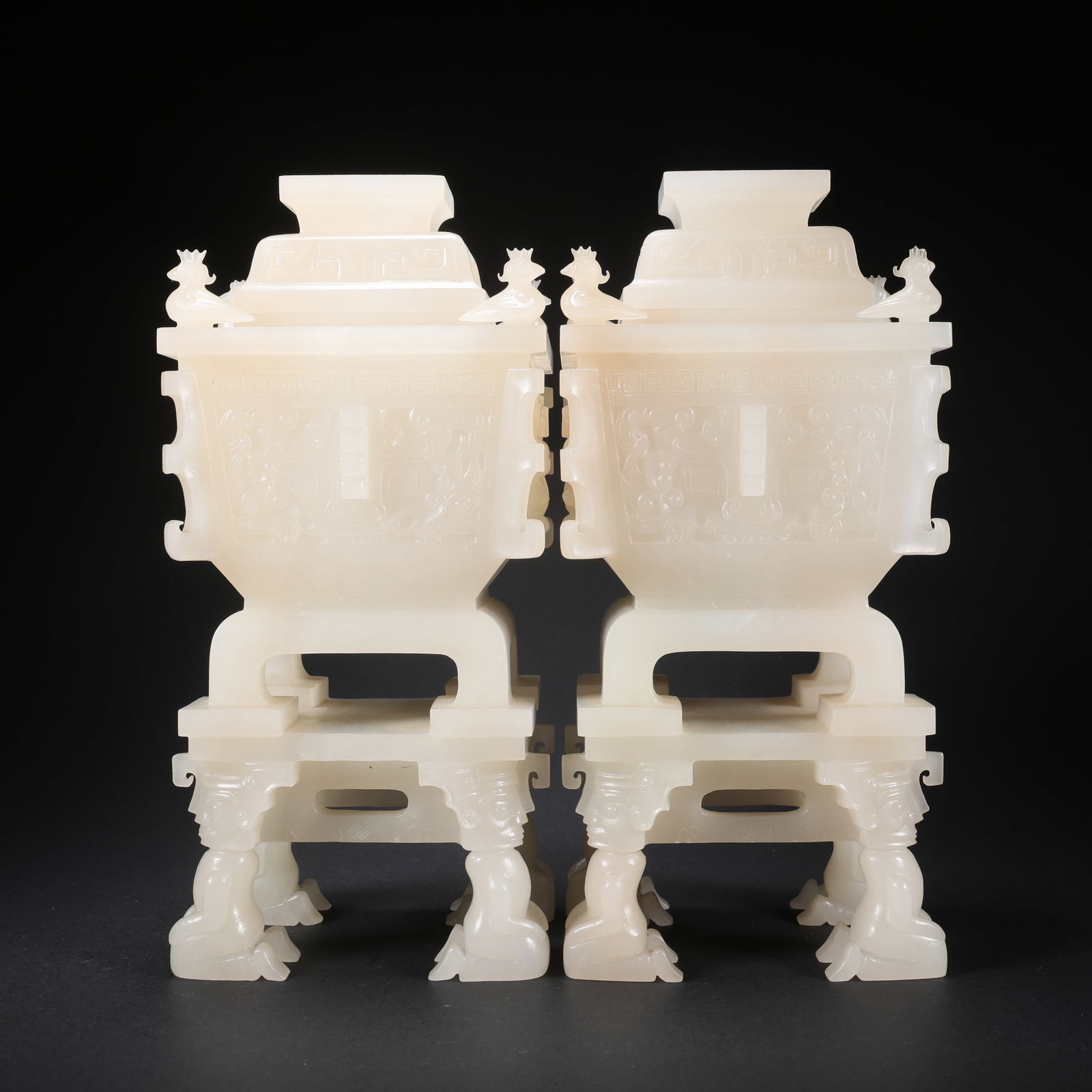 A PAIR OF HETIAN JADE SQUARE DING CENSERS WITH FOUR KNEELING FIGURES AS LEGS AND BIRD MOTIFS, WITH: Pair of Hetian Jade Square Ding Censers with Four Kneeling Figures as Legs and Bird Motifs, with Covers