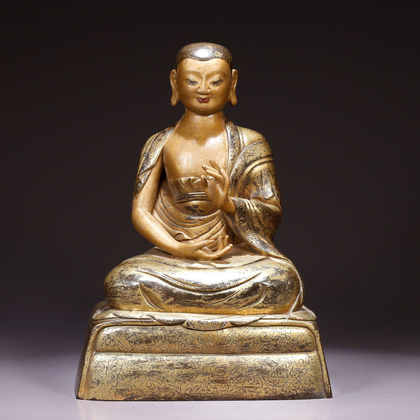 A GILT BRONZE STATUE OF AN ARHAT (1 of 9)