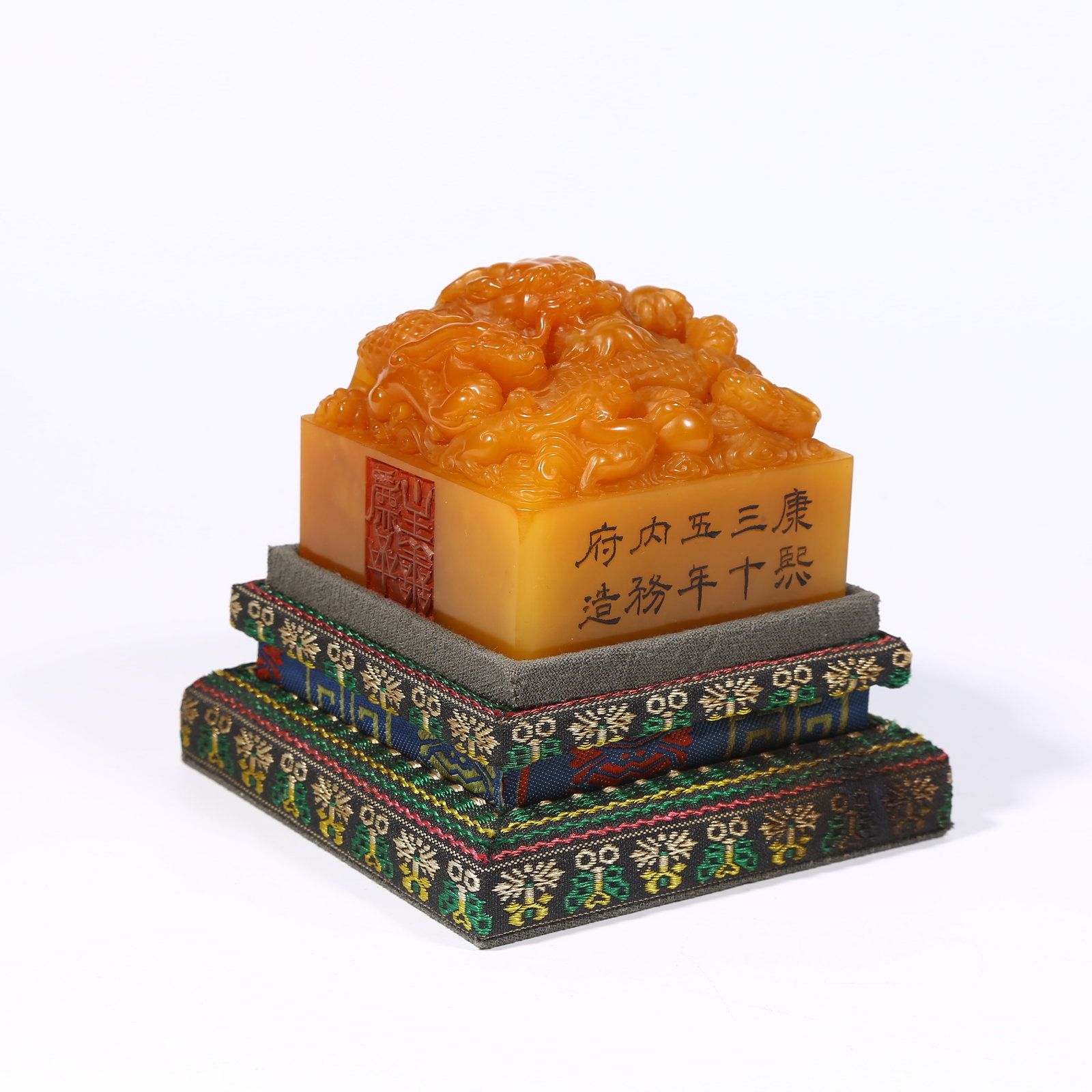 A SHOUSHAN TIANHUANG STONE SEAL WITH DRAGON KNOB: Shoushan Tianhuang stone seal with dragon knob