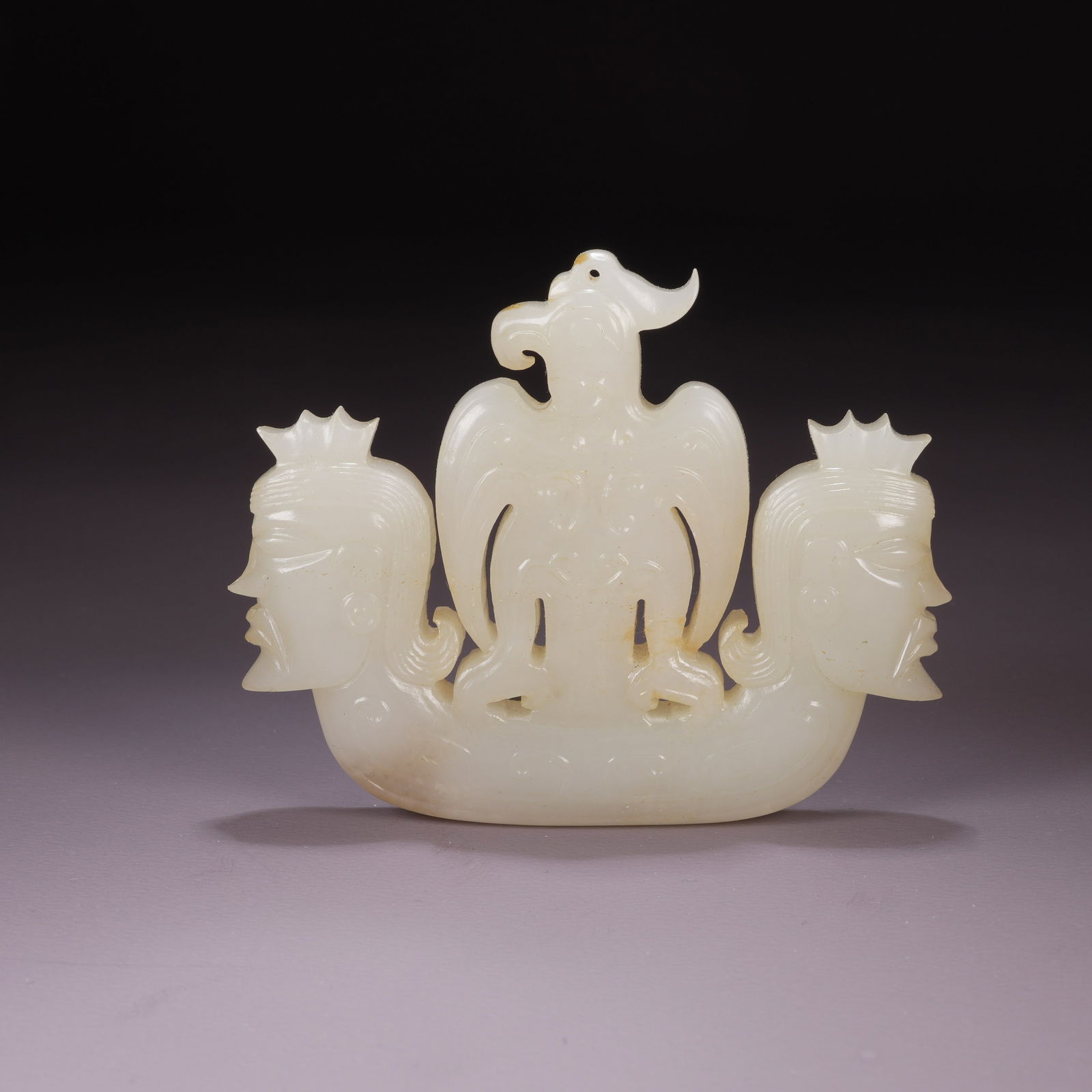 A HETIAN JADE ORNAMENT WITH DEITY FIGURE AND PHOENIX MOTIF (1 of 8)