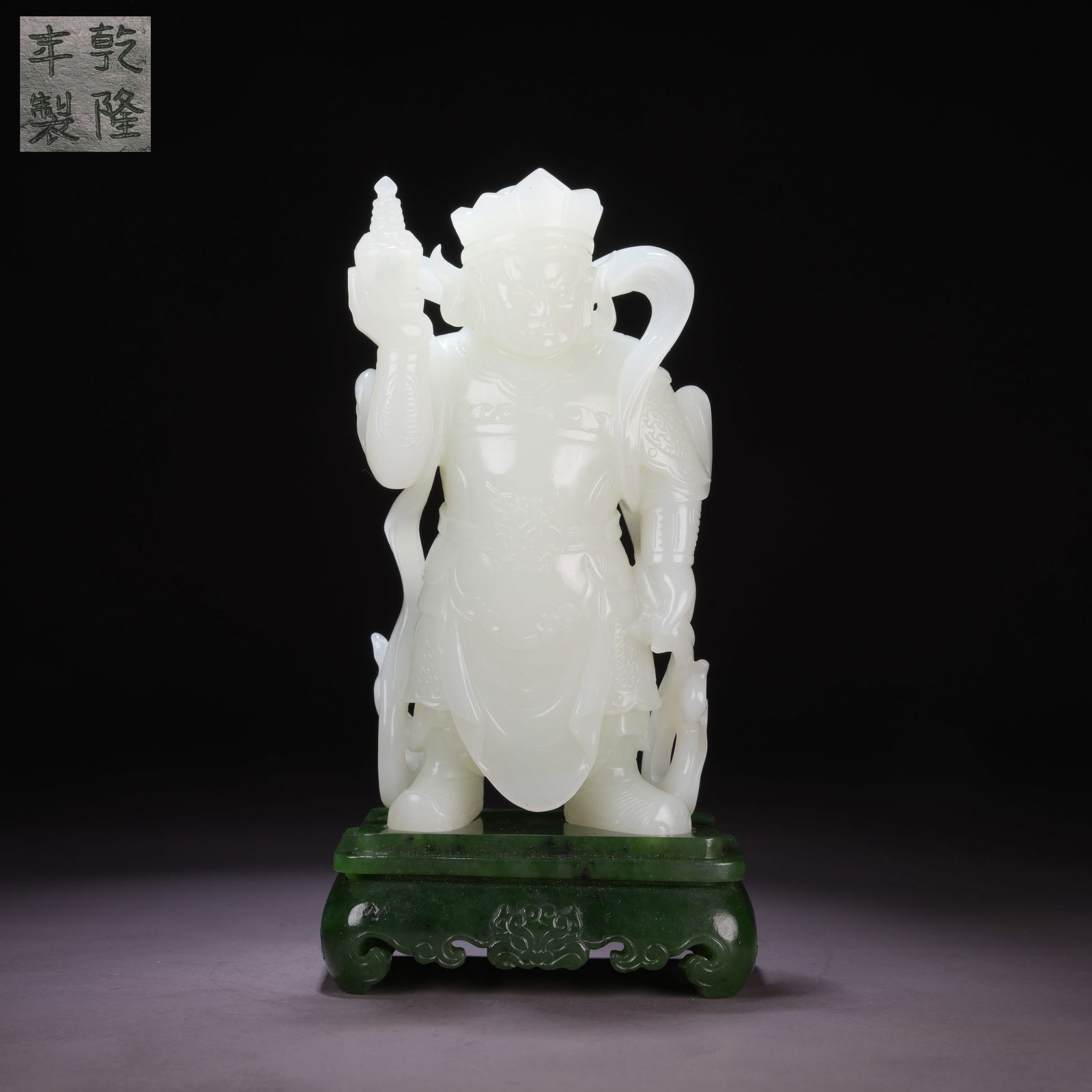 A HETIAN WHITE JADE HEAVENLY KING HOLDING A PAGODA WITH INLAID GREEN-JADE BASE (1 of 8)