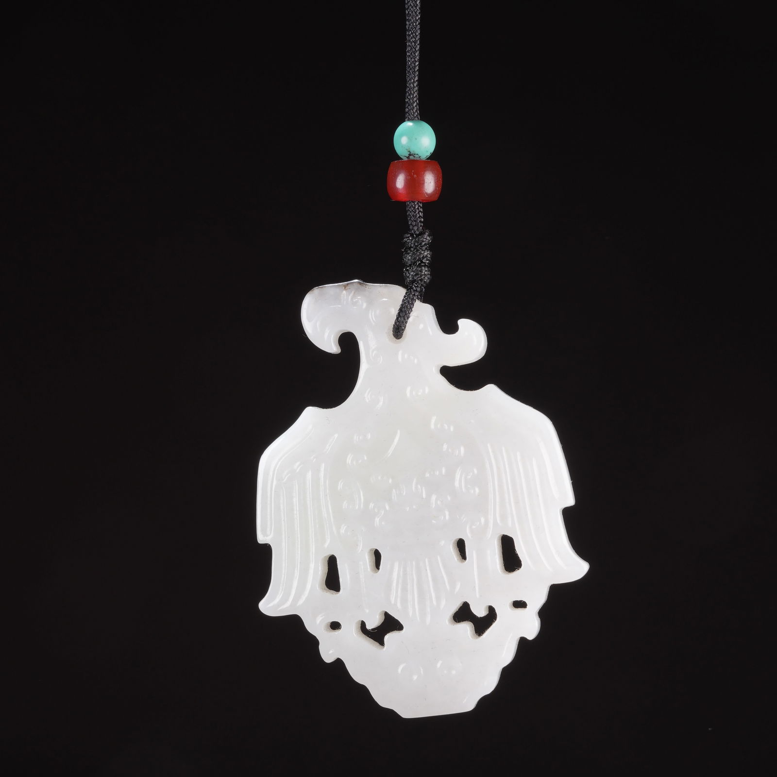 A HIGH-ANTIQUITY JADE DEITY AND PHOENIX PENDANT (1 of 8)