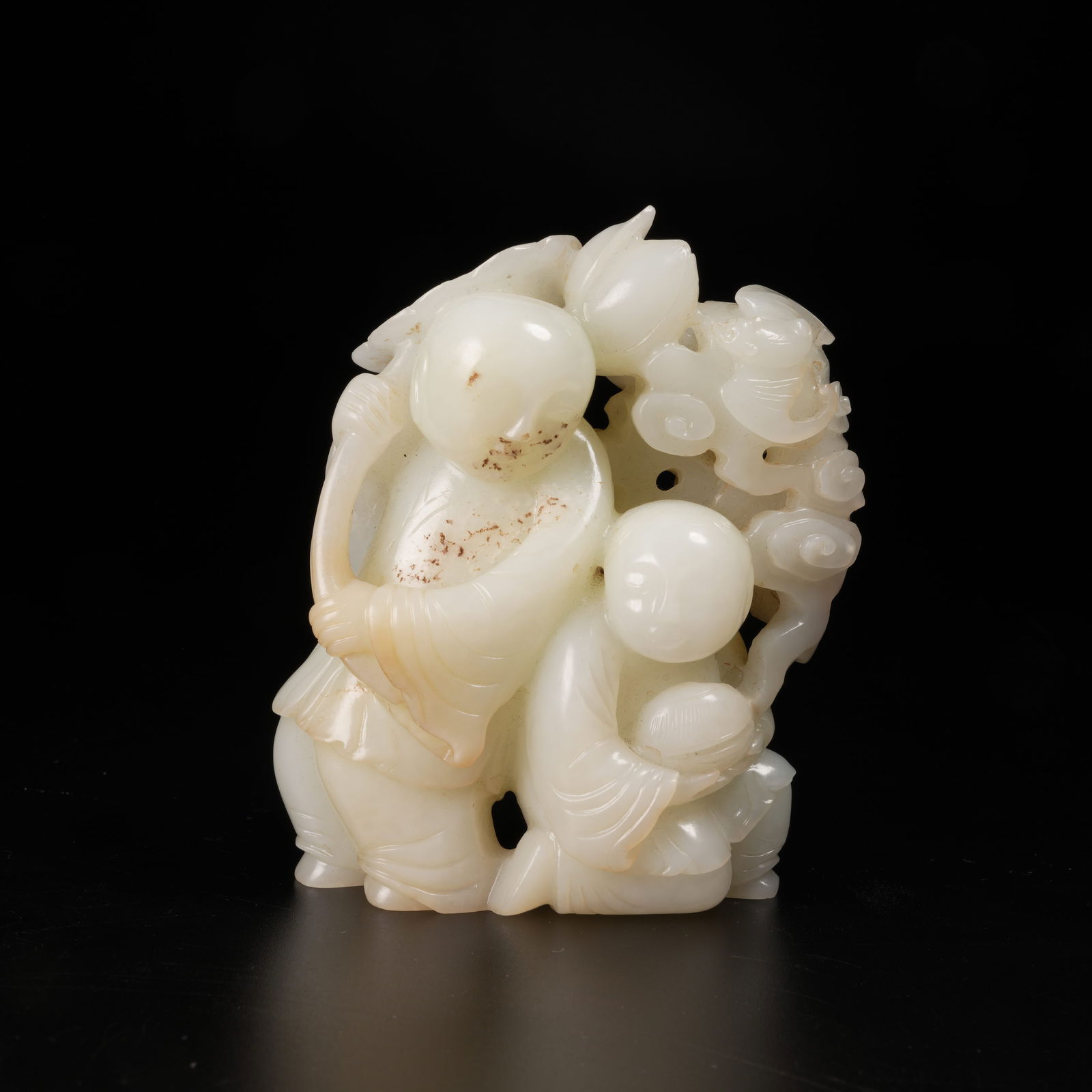 A HETIAN JADE HEHE ERXIAN (IMMORTALS OF HARMONY) FIGURE: Hetian jade Hehe Erxian (Immortals of Harmony) figure