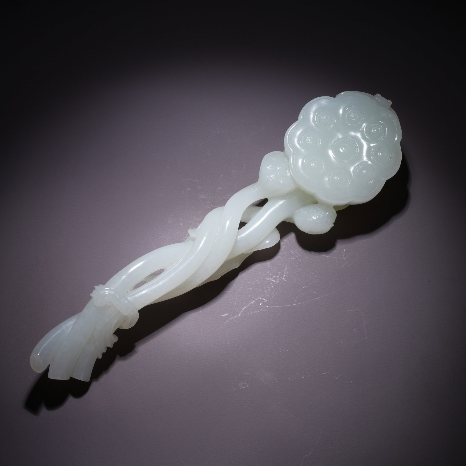 A HETIAN WHITE JADE LOTUS-ROOT–SHAPED RUYI SCEPTER (1 of 8)