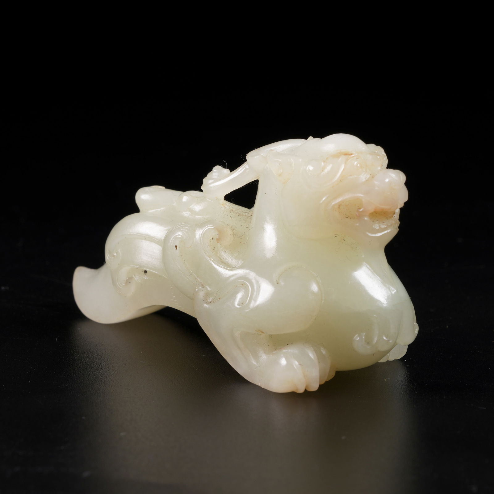 A HETIAN JADE AUSPICIOUS BEAST PENDANT (1 of 8)