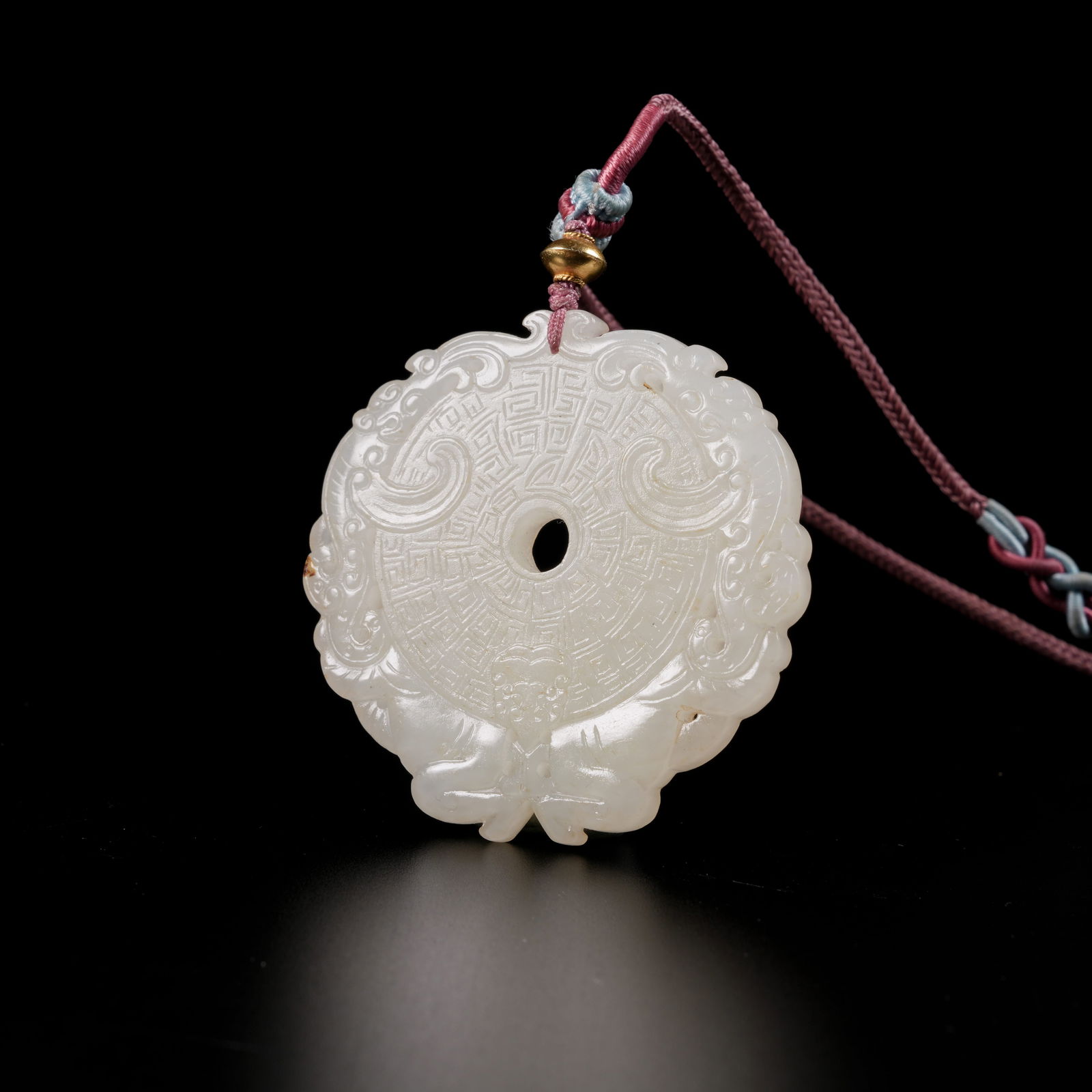 A HETIAN JADE AUSPICIOUS BEAST–PATTERN PENDANT (1 of 8)