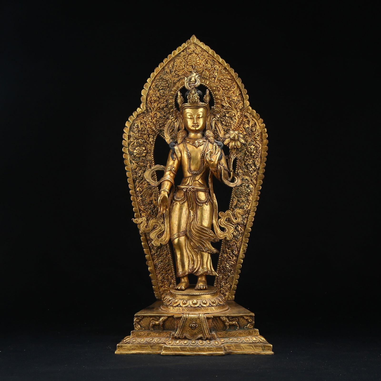 A GILT BRONZE STANDING AVALOKITESHVARA WITH LOTUS IN HAND (1 of 8)