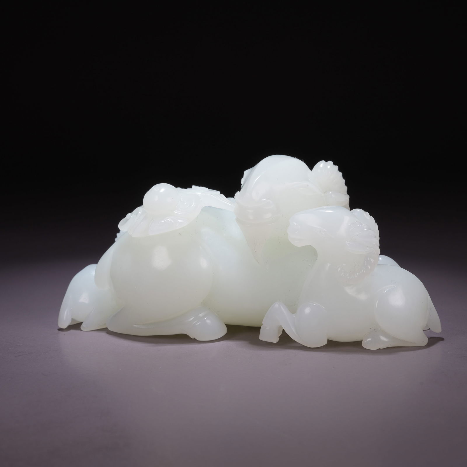 A HETIAN WHITE JADE "THREE RAMS BRINGING AUSPICIOUSNESS" ORNAMENT (1 of 8)