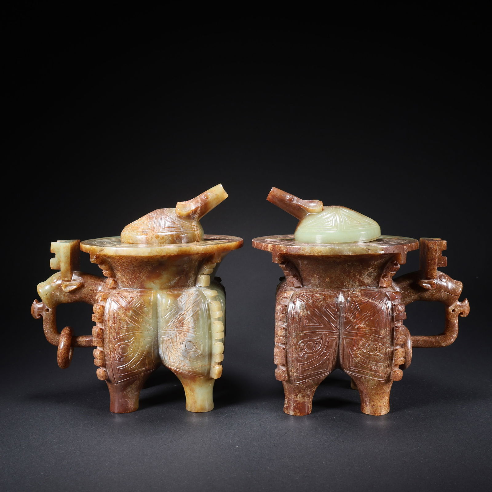 A PAIR OF HETIAN JADE WINE VESSELS WITH DRAGON-HEAD MOVABLE RINGS: Pair of Hetian Jade Wine Vessels with Dragon-Head Movable Rings