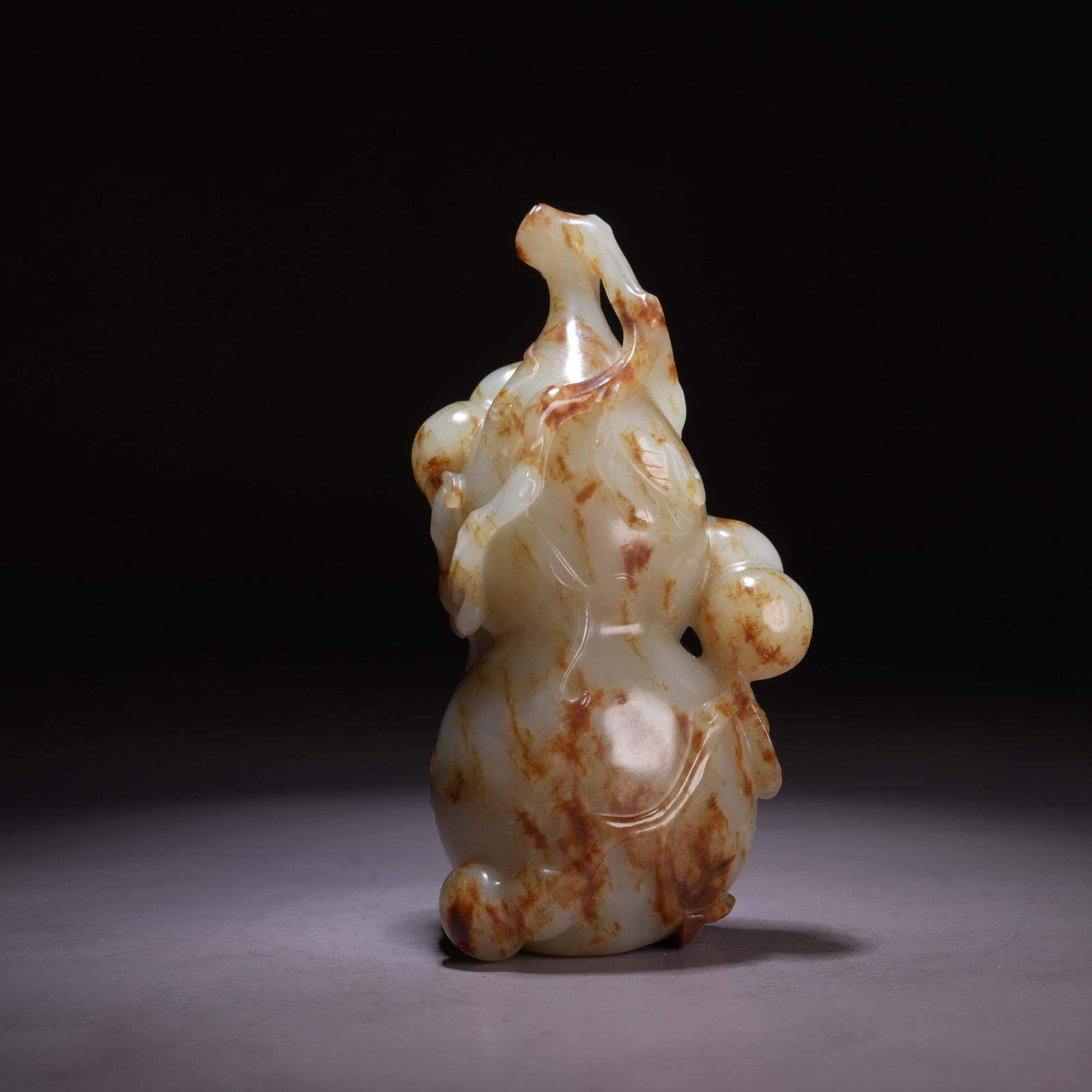 A HETIAN JADE "BLESSINGS AND PROSPERITY FOR TEN THOUSAND GENERATIONS" ORNAMENT (1 of 8)