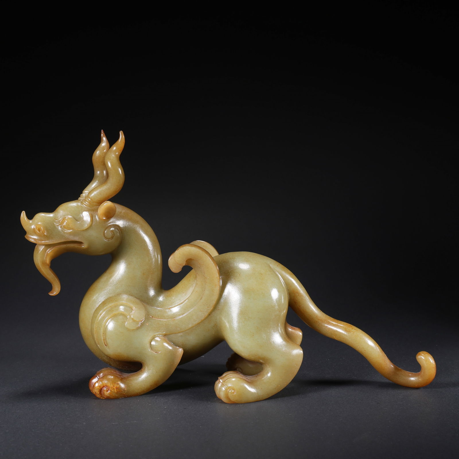 A HETIAN JADE DOUBLE-HORNED LONG-TAILED BEAST: Hetian Jade Double-Horned Long-Tailed Beast