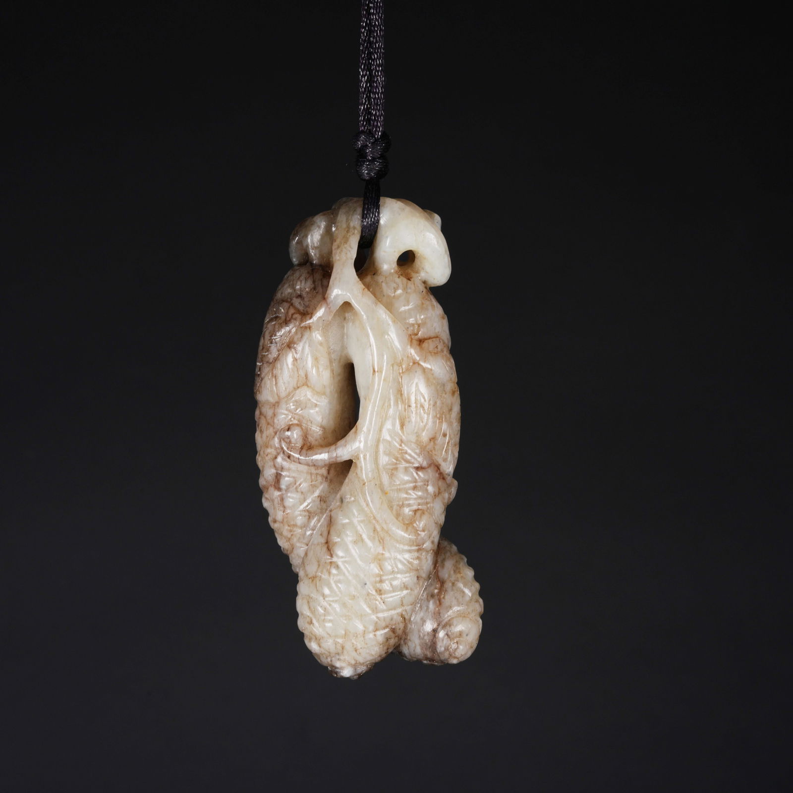 A HETIAN JADE MELON AND FRUIT PENDANT: Hetian Jade Melon and Fruit Pendant
