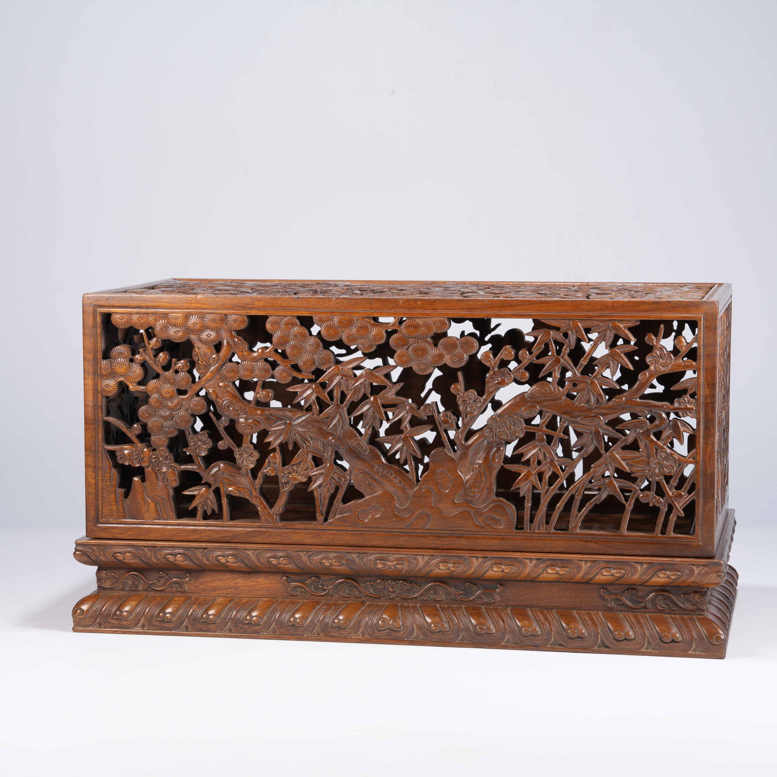A HUANGHUALI CARVED PLUM, ORCHID, BAMBOO, AND CHRYSANTHEMUM SQUARE BOX WITH COVER: Huanghuali Carved Plum, Orchid, Bamboo, and Chrysanthemum Square Box with Cover