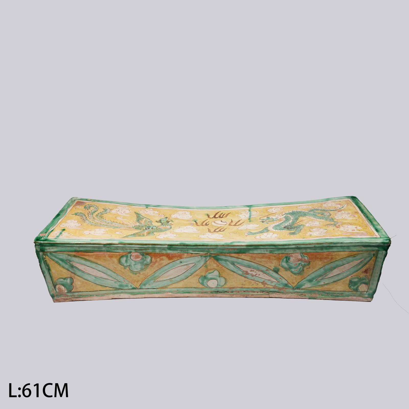 A LARGE RED-AND-GREEN ENAMELED PORCELAIN PILLOW WITH DRAGON-AND-PHOENIX MOTIF: Large red-and-green enameled porcelain pillow with dragon-and-phoenix motif