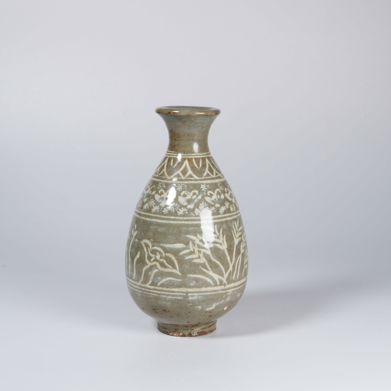 A CELADON YUHUCHUN VASE WITH FLORAL MOTIF: Celadon yuhuchun vase with floral motif