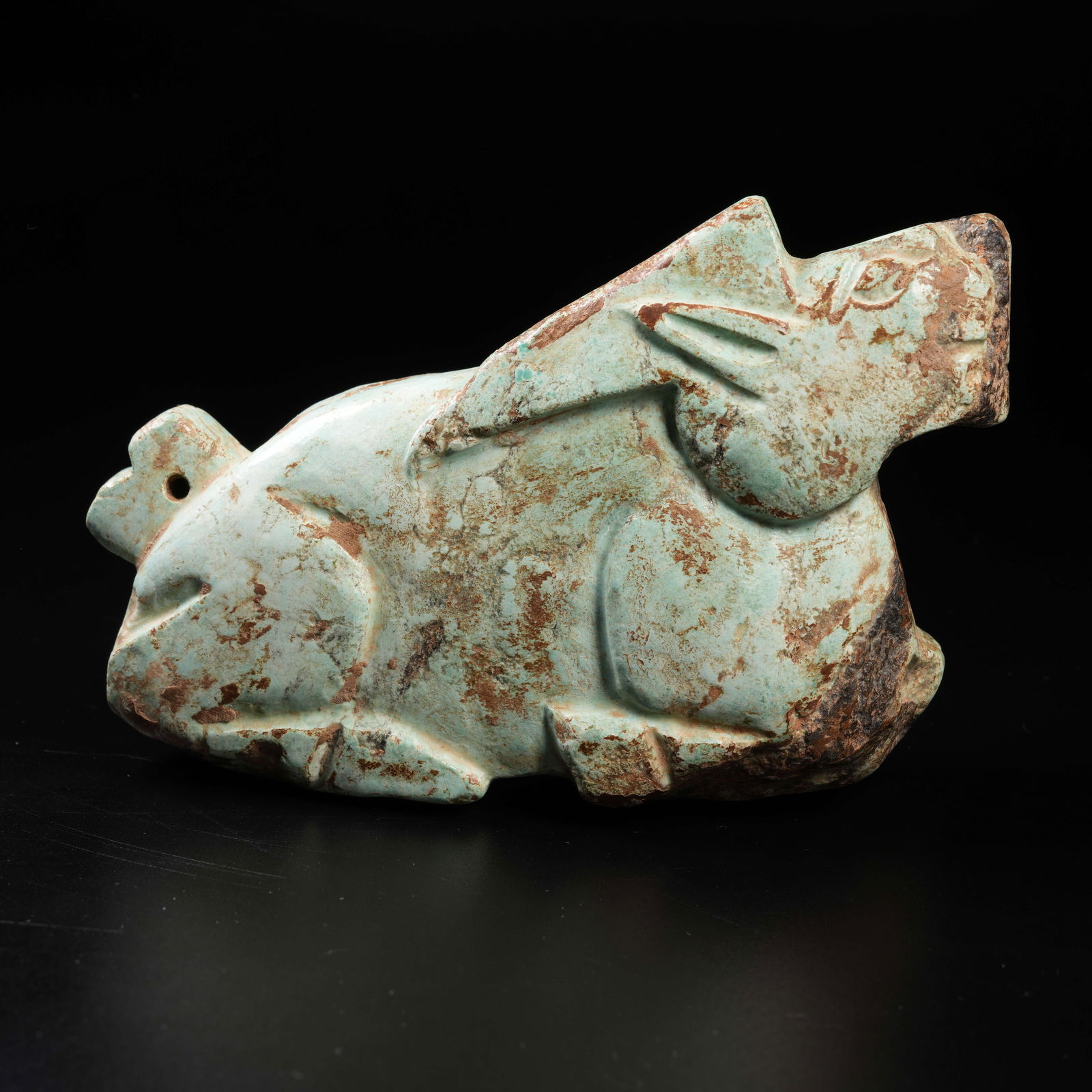 A TURQUOISE MYTHICAL-BEAST ORNAMENT: Turquoise mythical-beast ornament