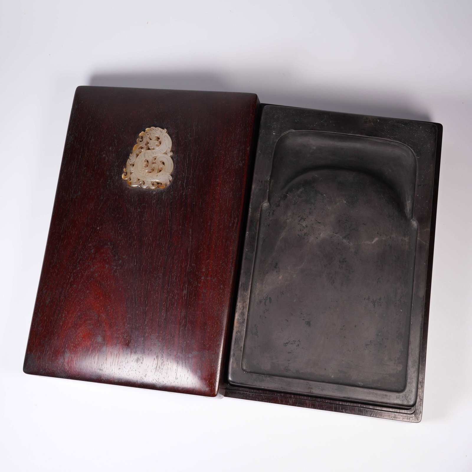A ZITAN INKSTONE BOX INLAID WITH ANCIENT JADE DRAGONS (WITH INKSTONE): Zitan inkstone box inlaid with ancient jade dragons (with inkstone)