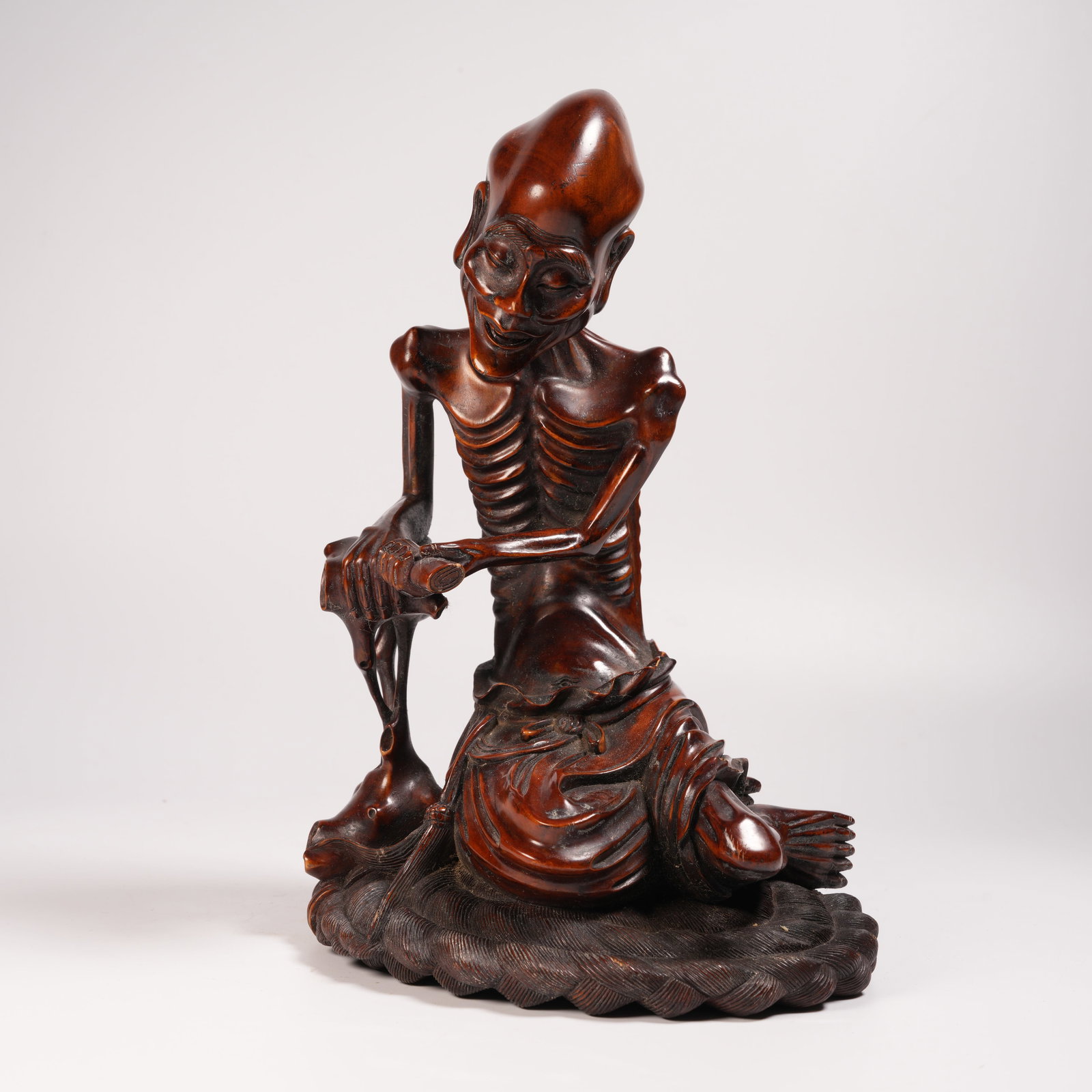 A HUANGHUALI SLENDER-ARHAT FIGURINE: Huanghuali Slender-Arhat Figurine