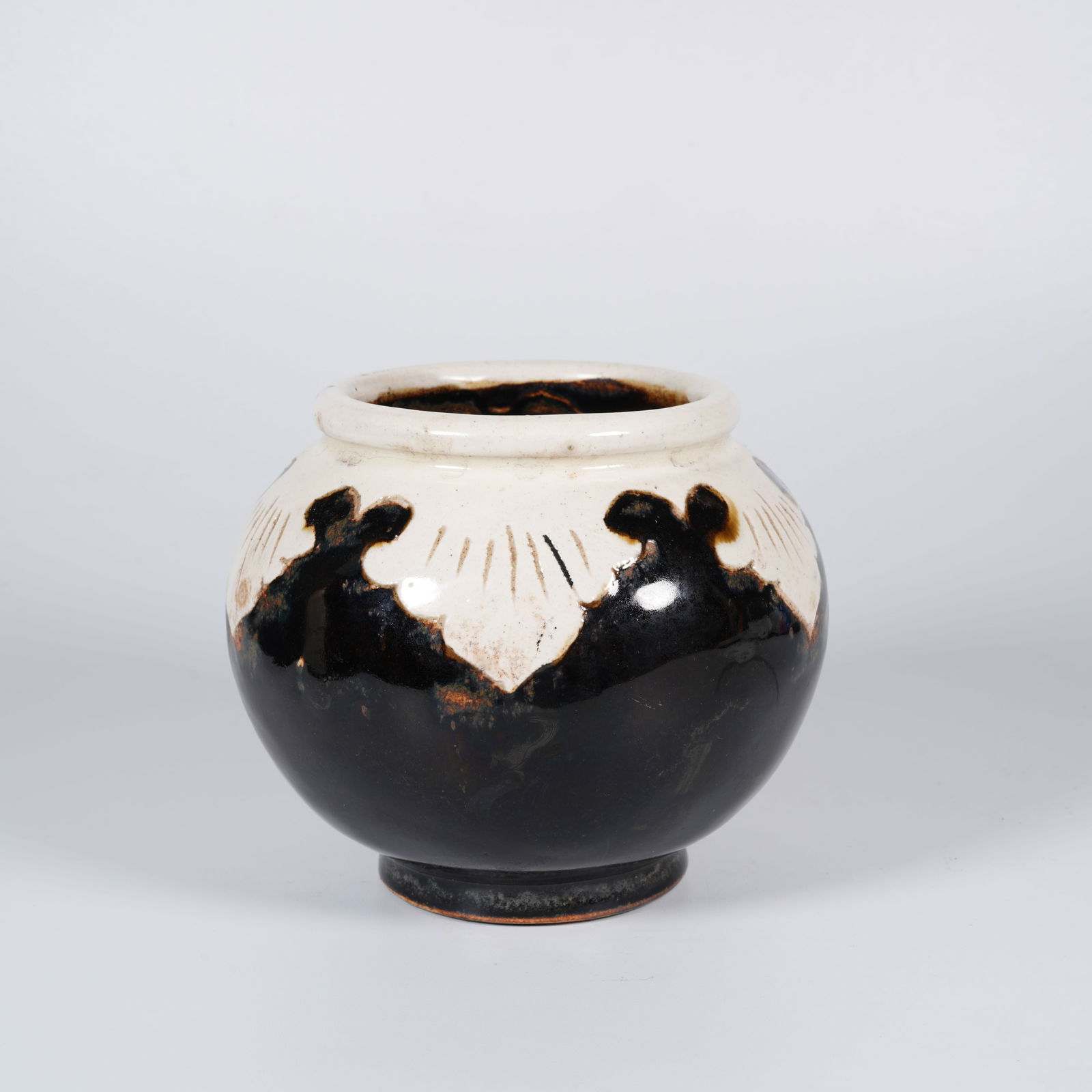 A BLACK-GLAZED JAR WITH RESERVED DECORATION (1 of 7)