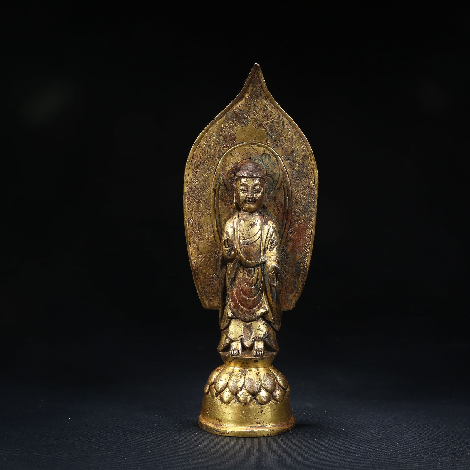 A GILT BRONZE STANDING BUDDHA STATUE (1 of 8)
