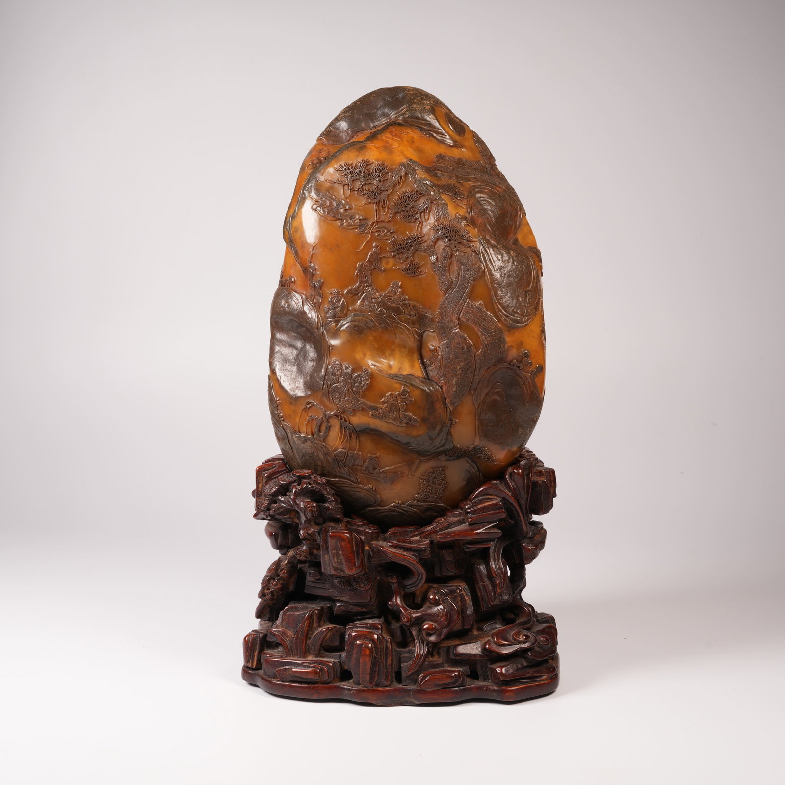 A SHOUSHAN STONE MINIATURE OF A SCHOLAR UNDER PINE ORNAMENT: Shoushan stone miniature of a scholar under pine ornament