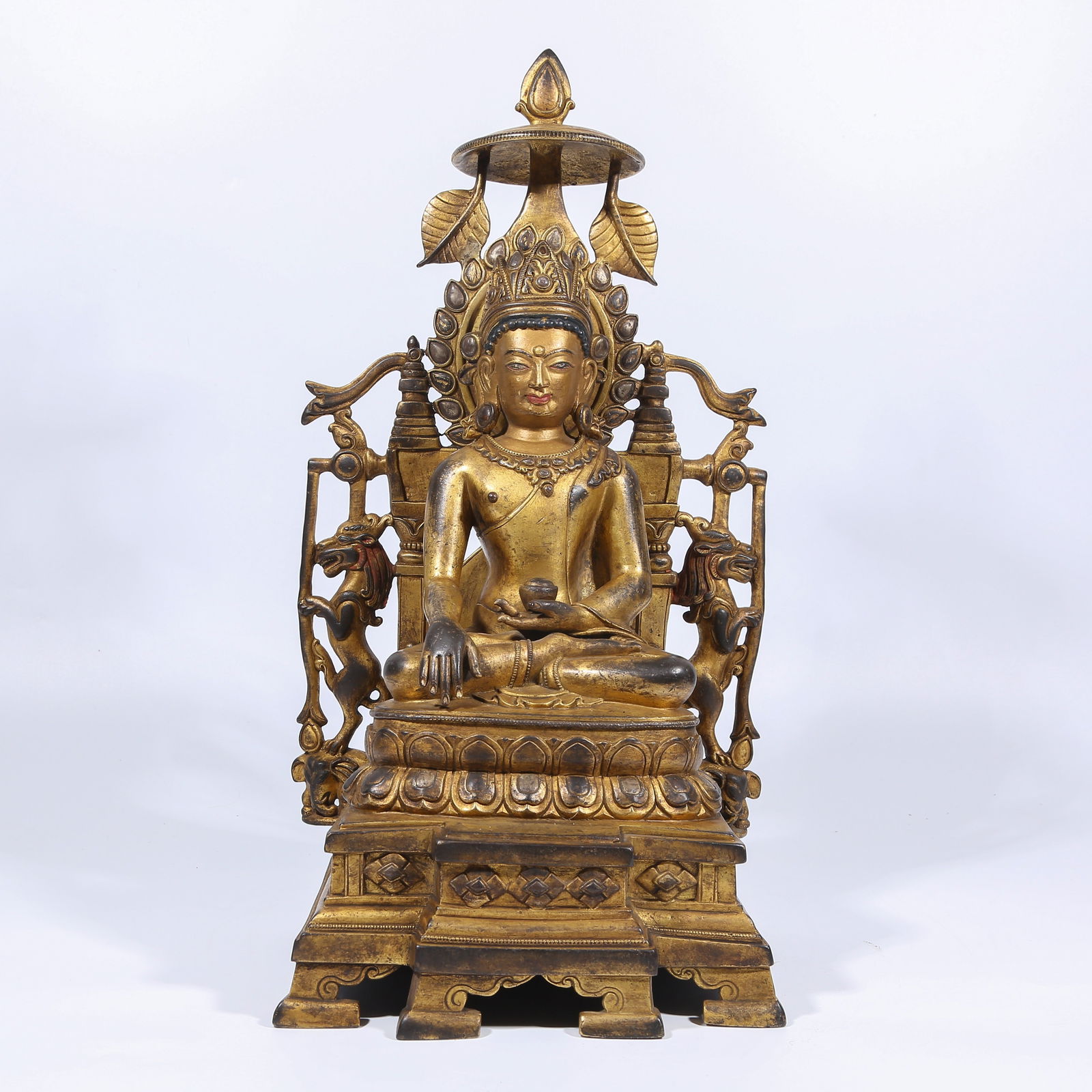 A GILT BRONZE CROWNED SHAKYAMUNI STATUE (1 of 8)