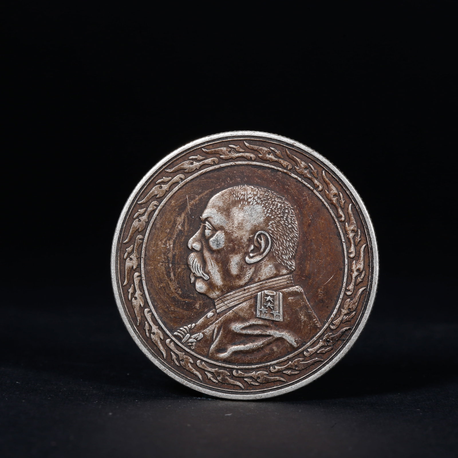 A SILVER DOLLAR COIN: One Silver dollar Coin