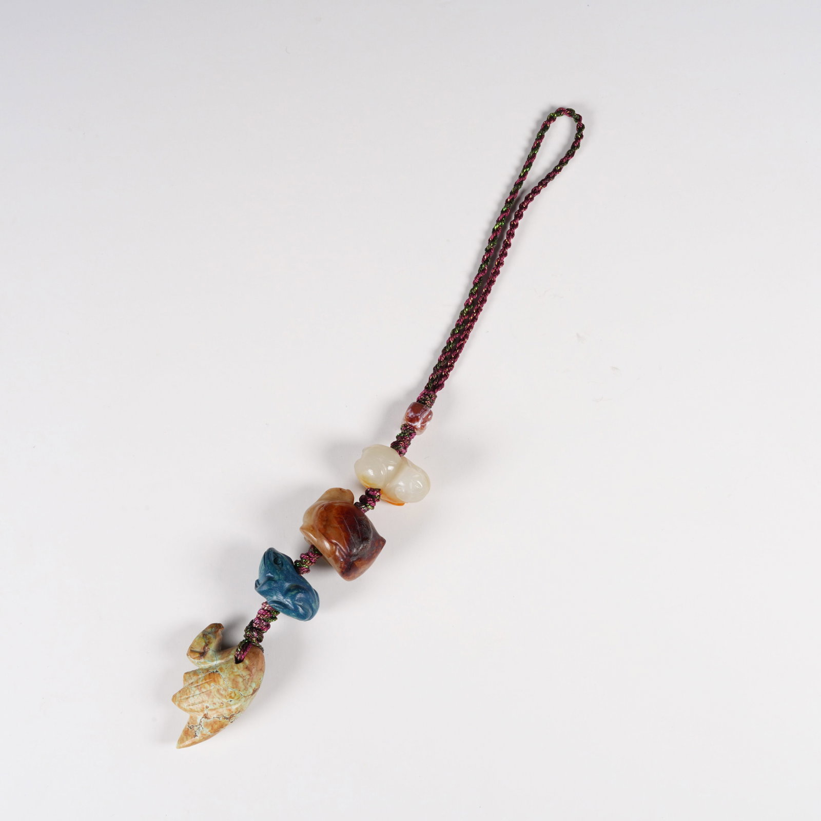 A HETIAN JADE MULTI-TREASURE BEAD STRAND: Hetian Jade Multi-Treasure Bead Strand