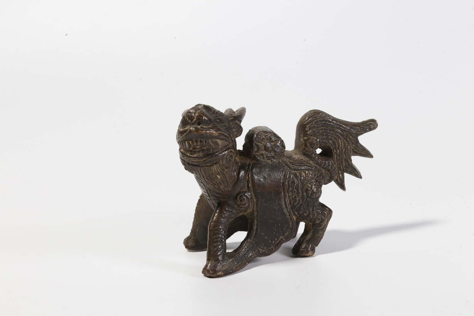 A BRONZE BEAST-SHAPED FIGURINE: Bronze Beast-Shaped Figurine