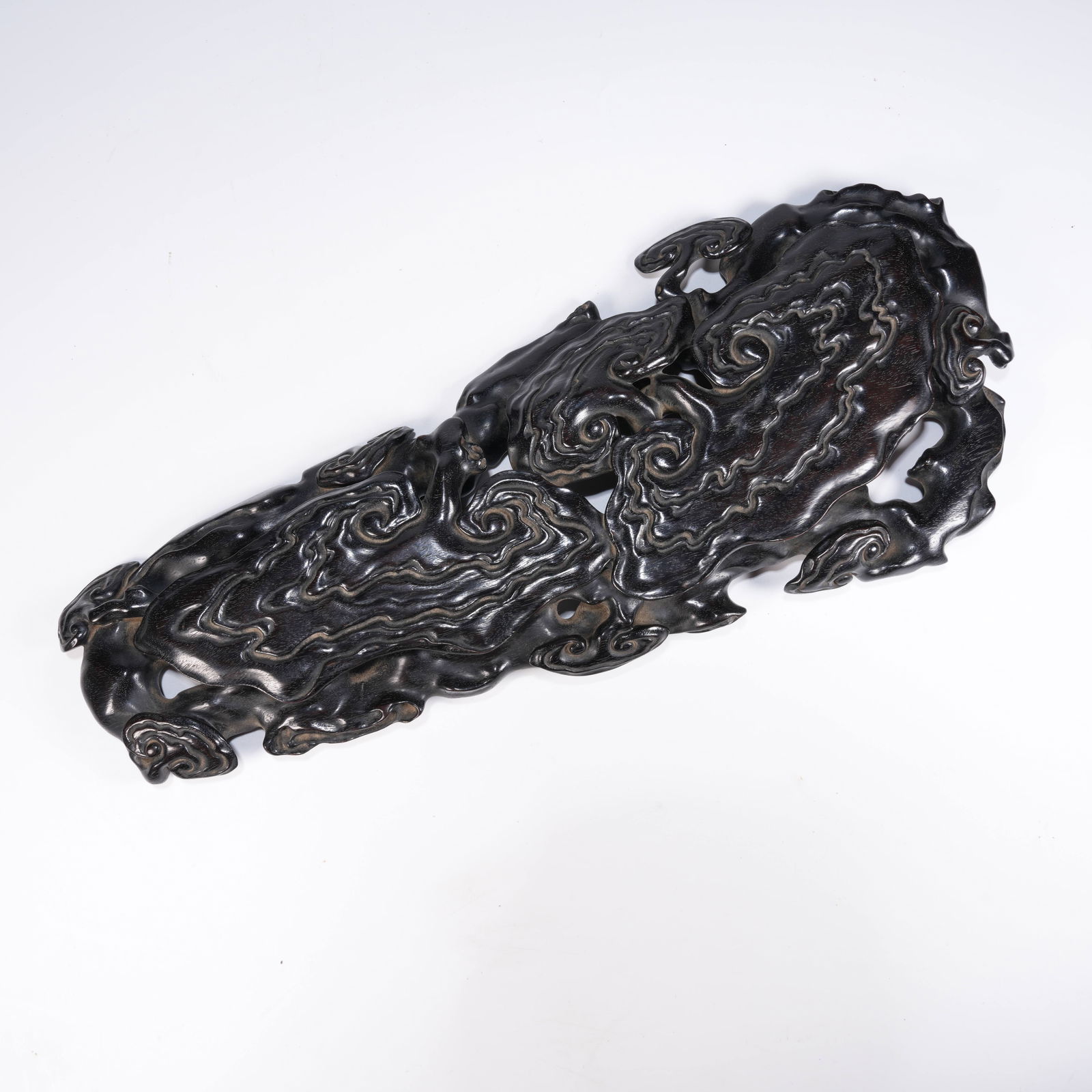 A SMALL-LEAF ZITAN RUYI-SHAPED BASE: Small-Leaf Zitan Ruyi-Shaped Base